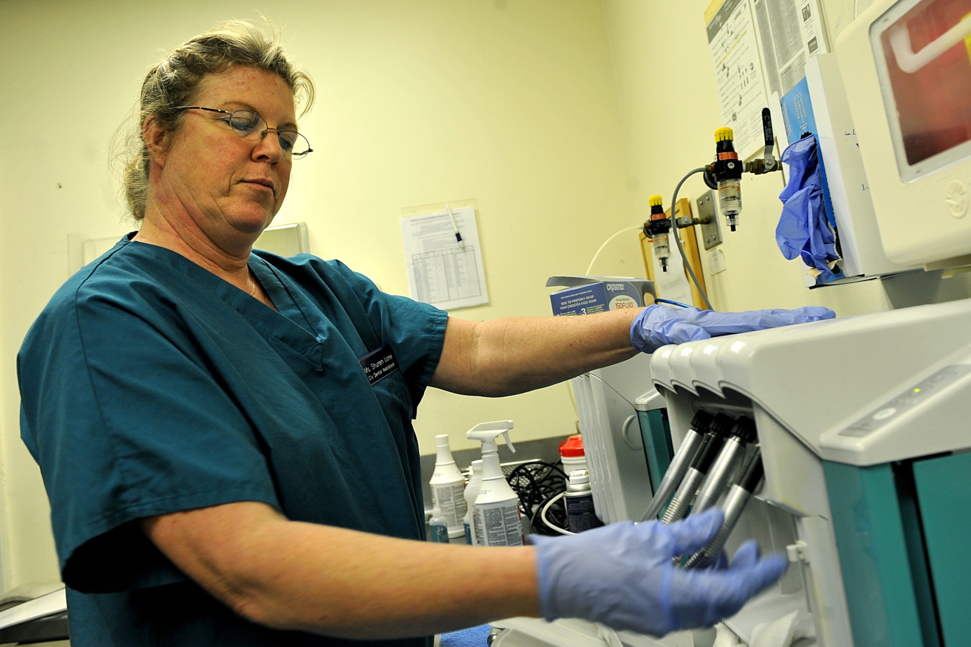 OFFUTT AIR FORCE BASE, Neb. - Shuren Lane, with the 55th Dental Squadron at the Ehrling Bergquist Clinic, cleans hand pieces inside the dental facility March 11. The 55th DS's orthodontics section provides support to an average of 150-200 patients each month for dental services and treatment.   

U.S. Air Force photo by Charles Haymond