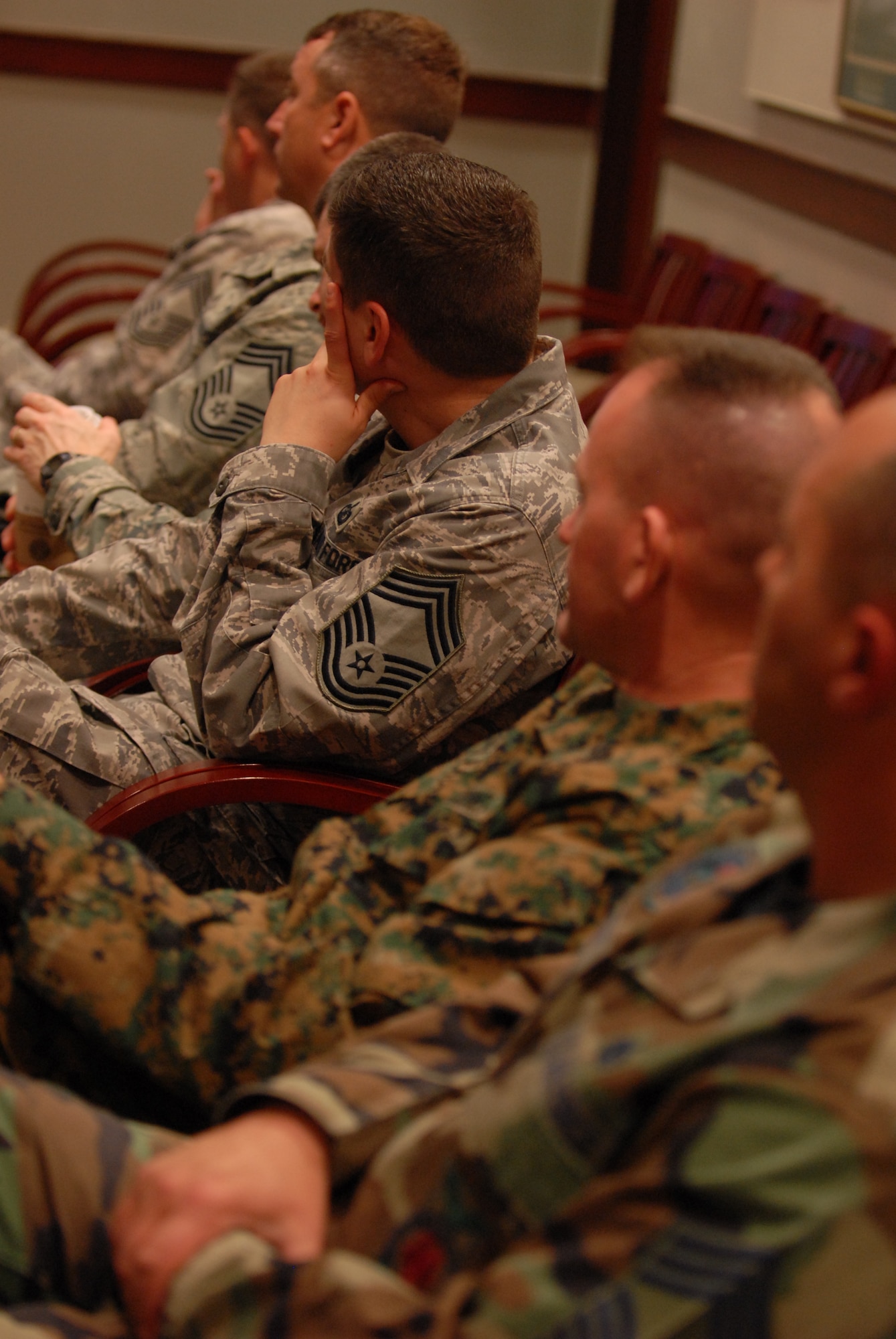 GOODFELLOW AIR FORCE BASE, Texas-- Air Force chief master sergeants and a Marine Corps master gunnery gather at the headquarter building's wing conference room for the March 12, get together of active duty and retired E-9's, the highest rank attainable in the enlist rank. 11 retired and seven active duty chiefs meet to discuss current issues effecting the base and local community. (U.S. Air Force photo/ Senior Airman Tong Duong)