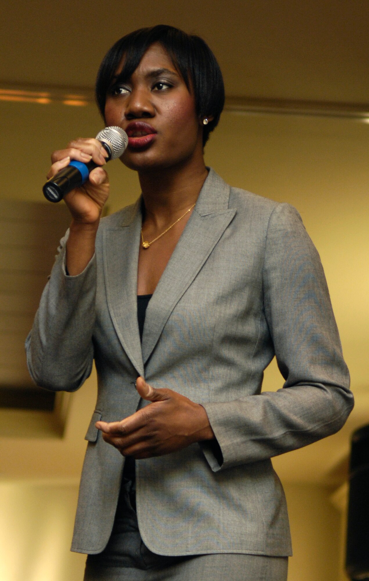 Carmen Coulter sings a rendition of the "Star Spangled Banner" during the National Prayer breakfast at the Charleston Club March 15. Those who attended the breakfast discussed individual and daily spiritual needs. Ms. Coulter sang four selections throughout the breakfast, including "God Bless America" as her closing song. Ms. Coulter was a guest singer for the prayer breakfast from the local community. (U.S. Air Force photo/Airman 1st Class Lauren Main)