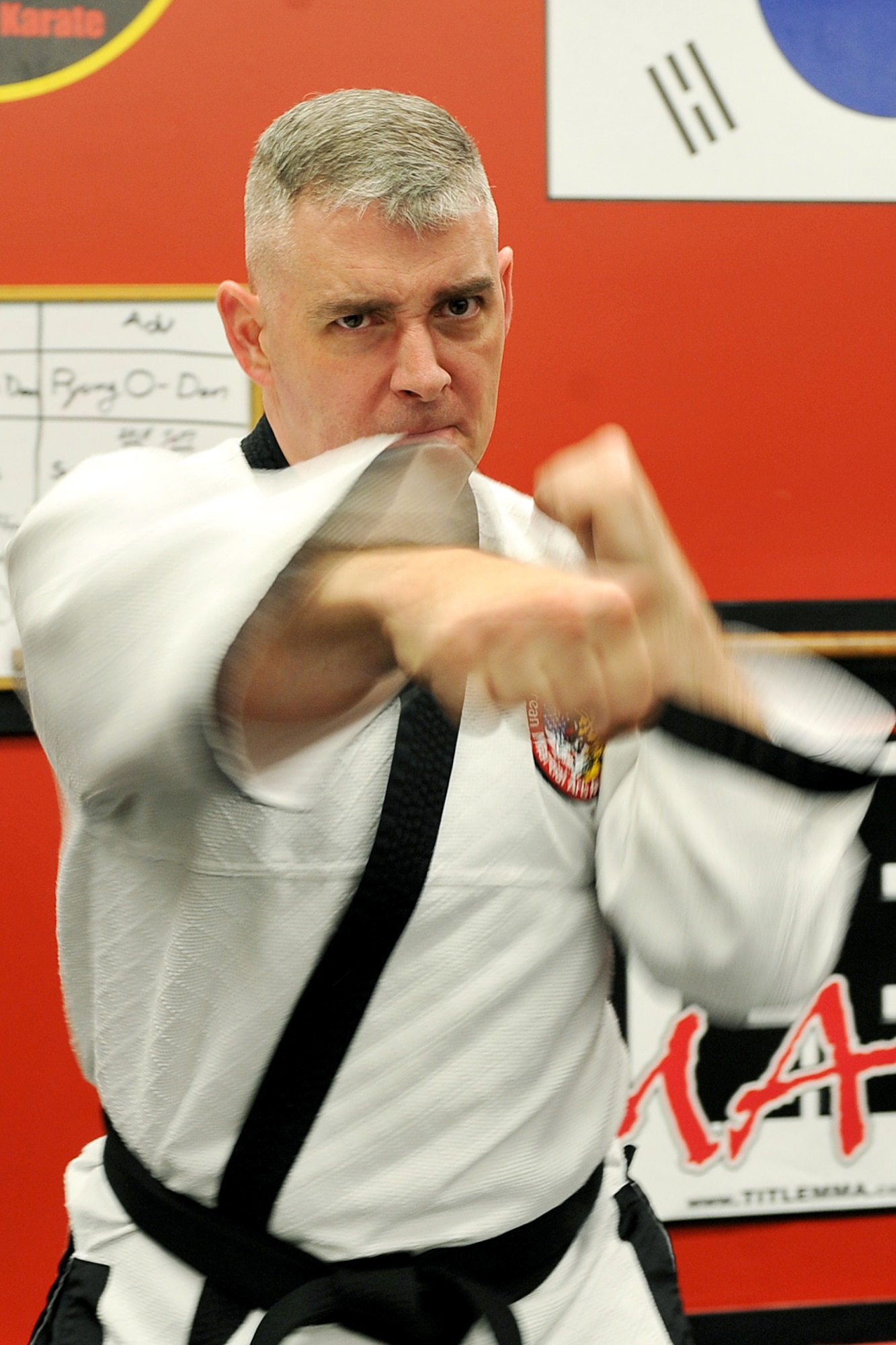 OFFUTT AIR FORCE BASE, Neb. - Technical Sgt. Michael Munyon, with the 55th Security Forces Squadron, practices his punches prior to teaching a hapkido class at an Omaha dojang March 12. Sergeant Munyon currently holds a 5th degree black belt in Taekwondo and a 2nd degree black belt in Hapkido, another form of Korean martial arts. He was recently inducted into the Masters Hall of Fame.

U.S. Air Force photo by Charles Haymond