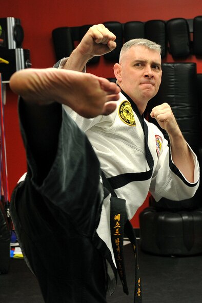 OFFUTT AIR FORCE BASE, Neb. - Technical Sgt. Michael Munyon, with the 55th Security Forces Squadron, practices sidekicks prior to teaching a hapkido class at an Omaha dojang March 12. Sergeant Munyon currently holds a 5th degree black belt in Taekwondo and a 2nd degree black belt in Hapkido, another form of Korean martial arts. He was recently inducted into the Masters Hall of Fame.

U.S. Air Force photo by Charles Haymond
