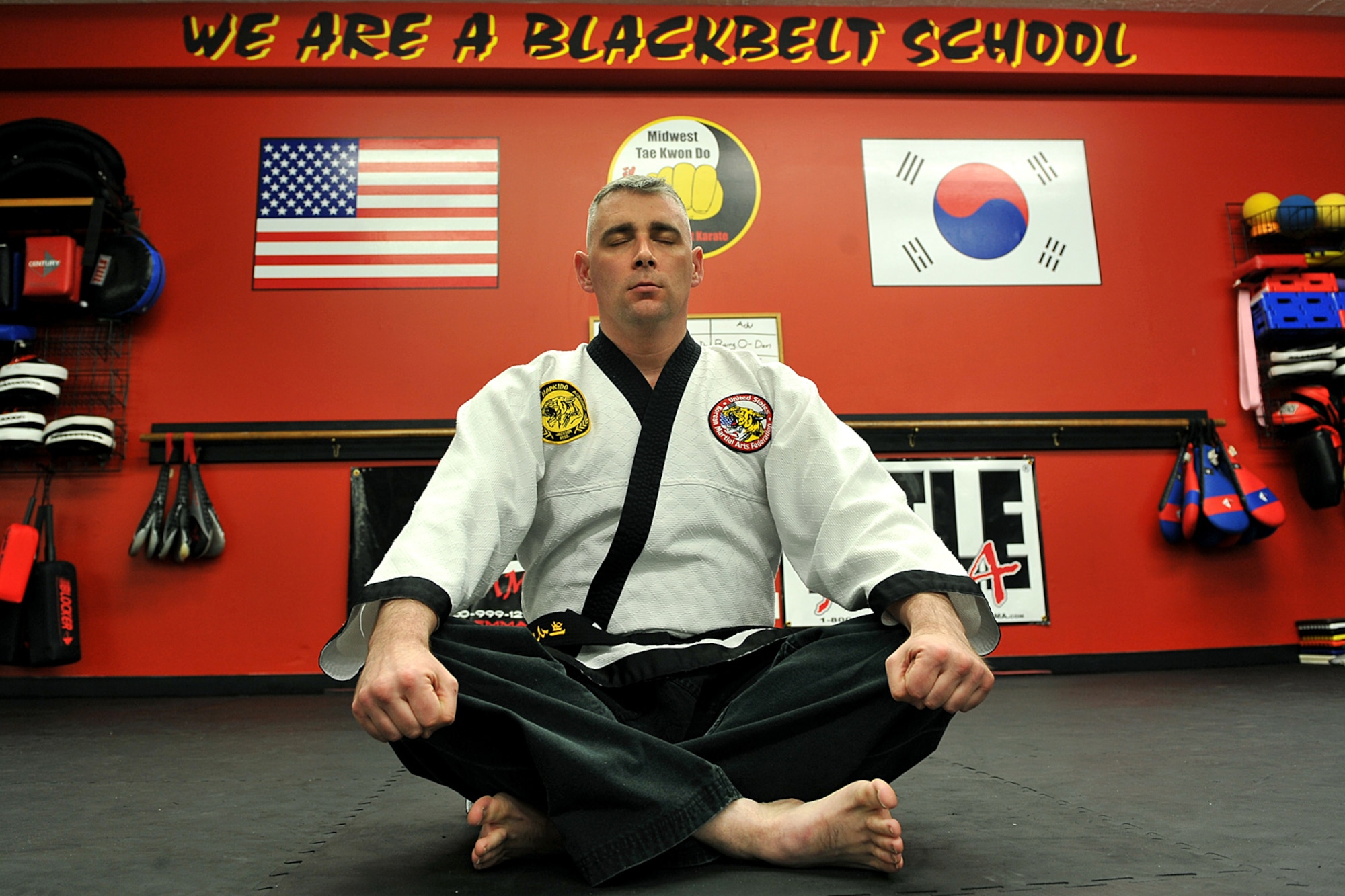 OFFUTT AIR FORCE BASE, Neb. - Technical Sgt. Michael Munyon, with the 55th Security Forces Squadron, meditates before teaching a hapkido class at an Omaha dojang March 12. Sergeant Munyon currently holds a 5th degree black belt in Taekwondo and a 2nd degree black belt in Hapkido, another form of Korean martial arts. He was recently inducted into the Masters Hall of Fame.

U.S. Air Force photo by Charles Haymond
