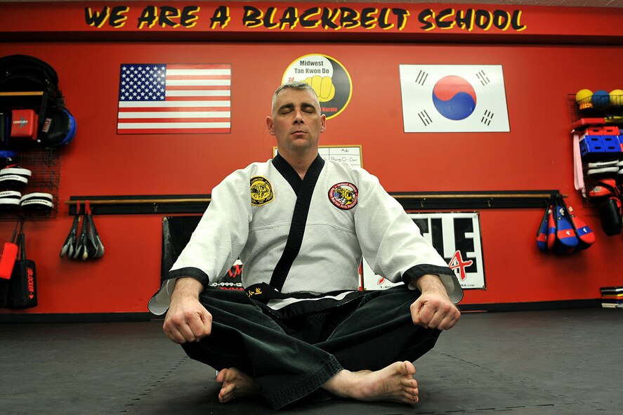 OFFUTT AIR FORCE BASE, Neb. - Technical Sgt. Michael Munyon, with the 55th Security Forces Squadron, meditates before teaching a hapkido class at an Omaha dojang March 12. Sergeant Munyon currently holds a 5th degree black belt in Taekwondo and a 2nd degree black belt in Hapkido, another form of Korean martial arts. He was recently inducted into the Masters Hall of Fame.

U.S. Air Force photo by Charles Haymond
