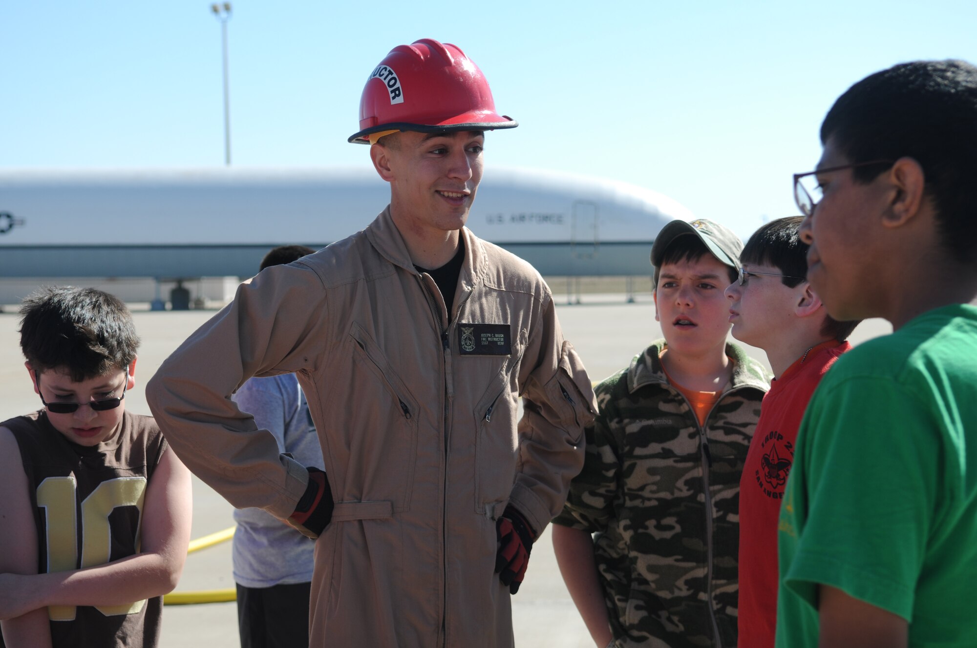 GOODFELLOW AIR FORCE BASE, Texas -- Staff Sgt. Joseph Baugh, an instructor with the 312th Training Squadron, speaks with Boy Scouts from Troop 22 during their visit to the Louis F. Garland Department of Defense Fire Academy, March 13, 2010. Twenty  Boy Scouts came to Goodfellow and completed the requirements to earn their Fire Merit badge. (U.S. Air Force photo/Airman 1st Class Clayton Lenhardt)