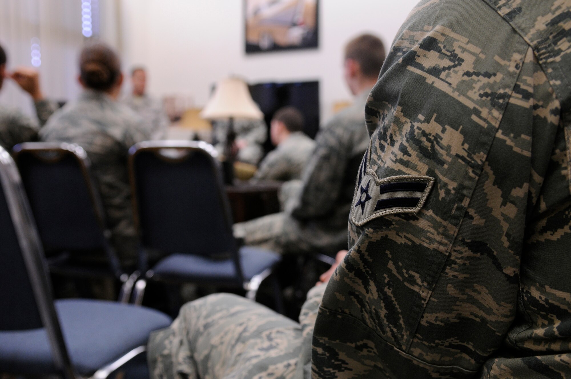 Students from the First Term Airmen Center attend a question and answer session at Club 7 Cafe, Ramstein Air Base, Germany, March 16, 2010. The Chapel established Club 7 due to a new Air Force initiative to provide an effective venue to minister to the spiritual and physical needs of single Airmen. (U.S. Air Force photo by Airman 1st Class Brittany Perry)