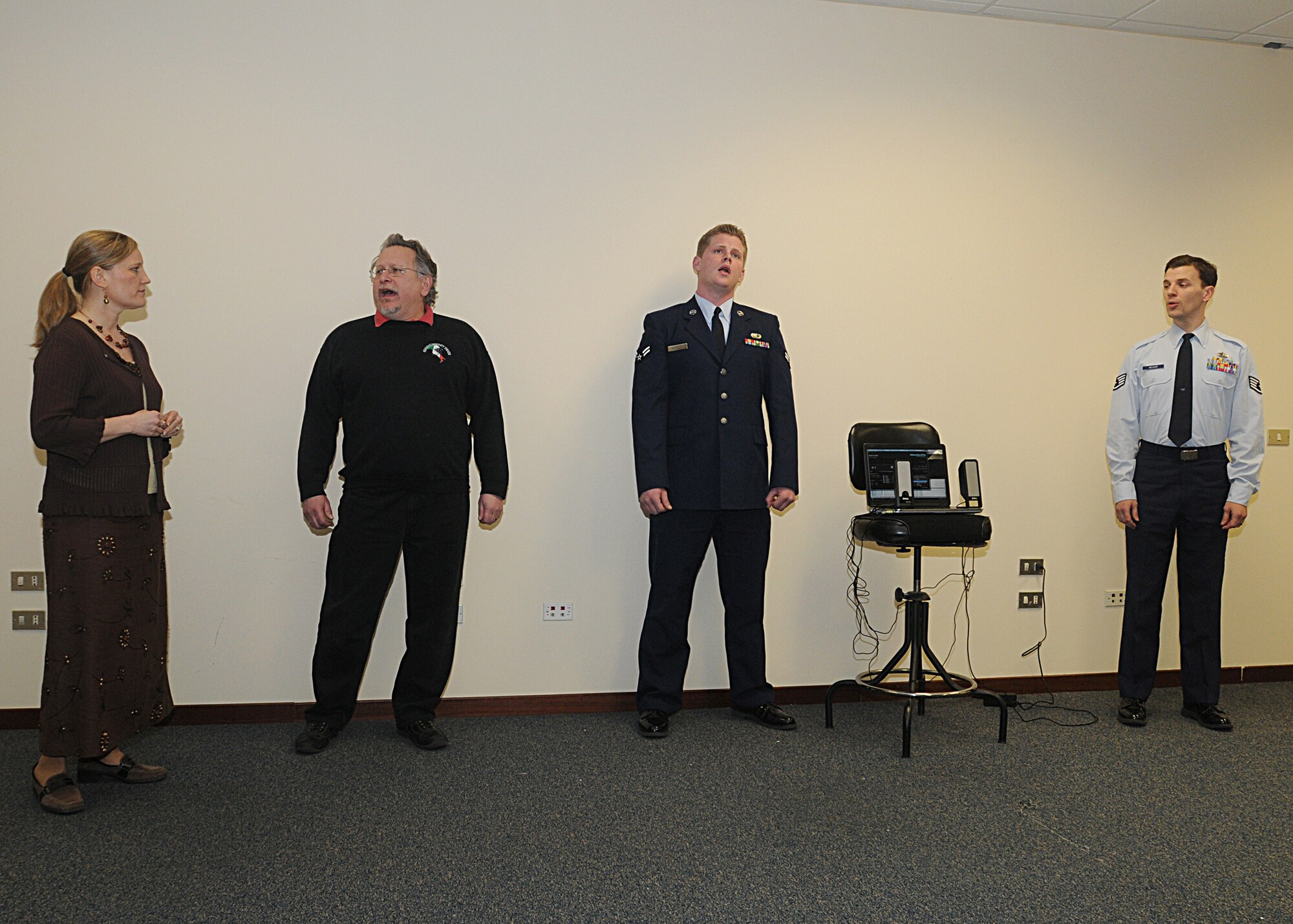 Members of the Aviano Community Theater sing during a teaser performance for the upcoming musical "Dr. Jekyll and Mr. Hyde" at the 31st Comptroller Squadron March 15.  The group is composed of active-duty members, local national Italians and dependents from around the Aviano area. Tickets are sold at the door and are $5 for E-4 and below or equivalent and $10 for anyone else.  (U.S. Air Force photo/Senior Airman Tabitha M. Mans)