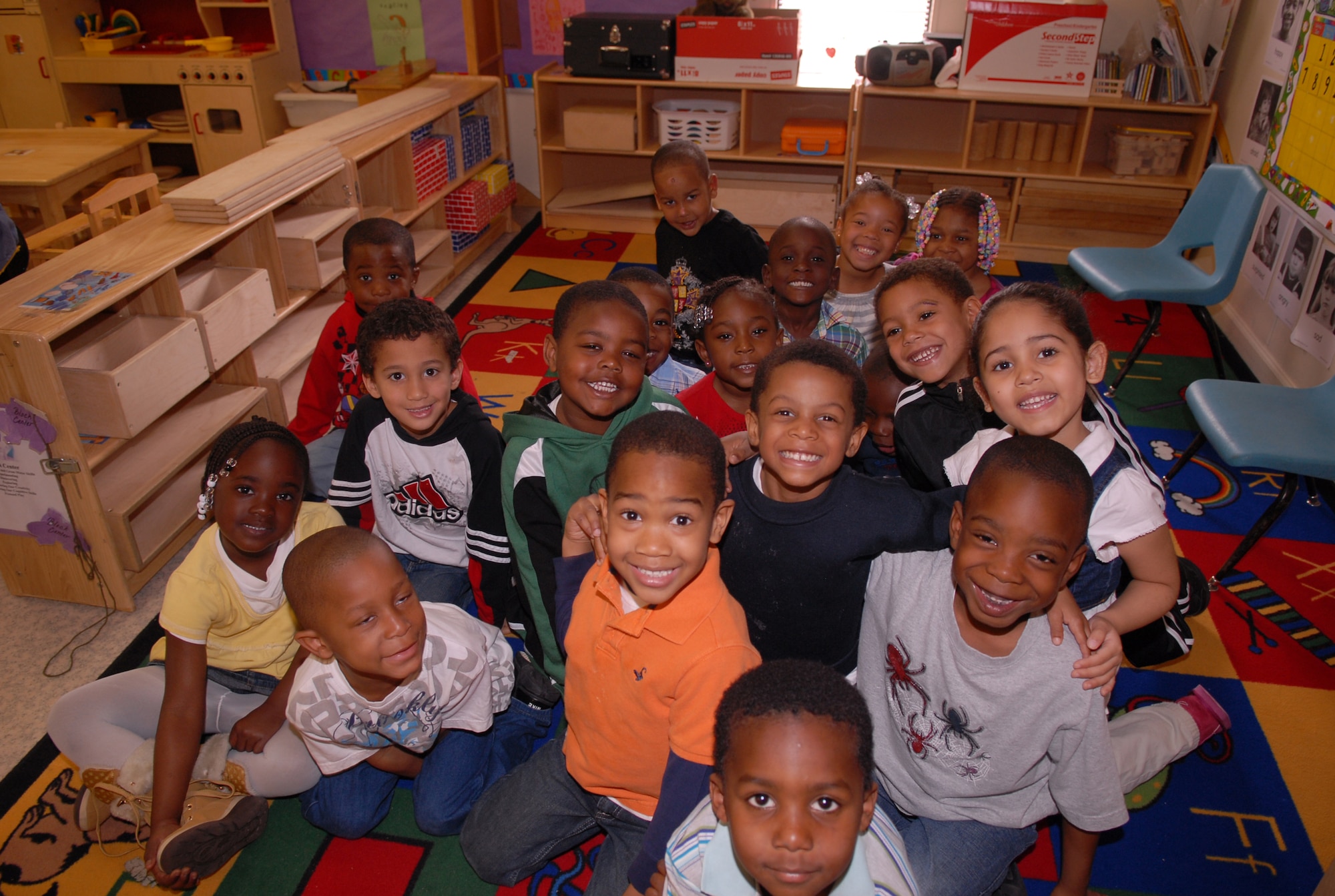 Students in the Head Start program in Fayetteville listen as Lt. Col. Terri Bailey, 43rd Medical Squadron, Commander, and Robert Hines, 43rd MDOS Honorary Commander, President and Chief Executive Officer of Cumberland County's United Way, read children's books March 11. (U.S. Air Force Photo/ 2nd Lt. Cammie Quinn)