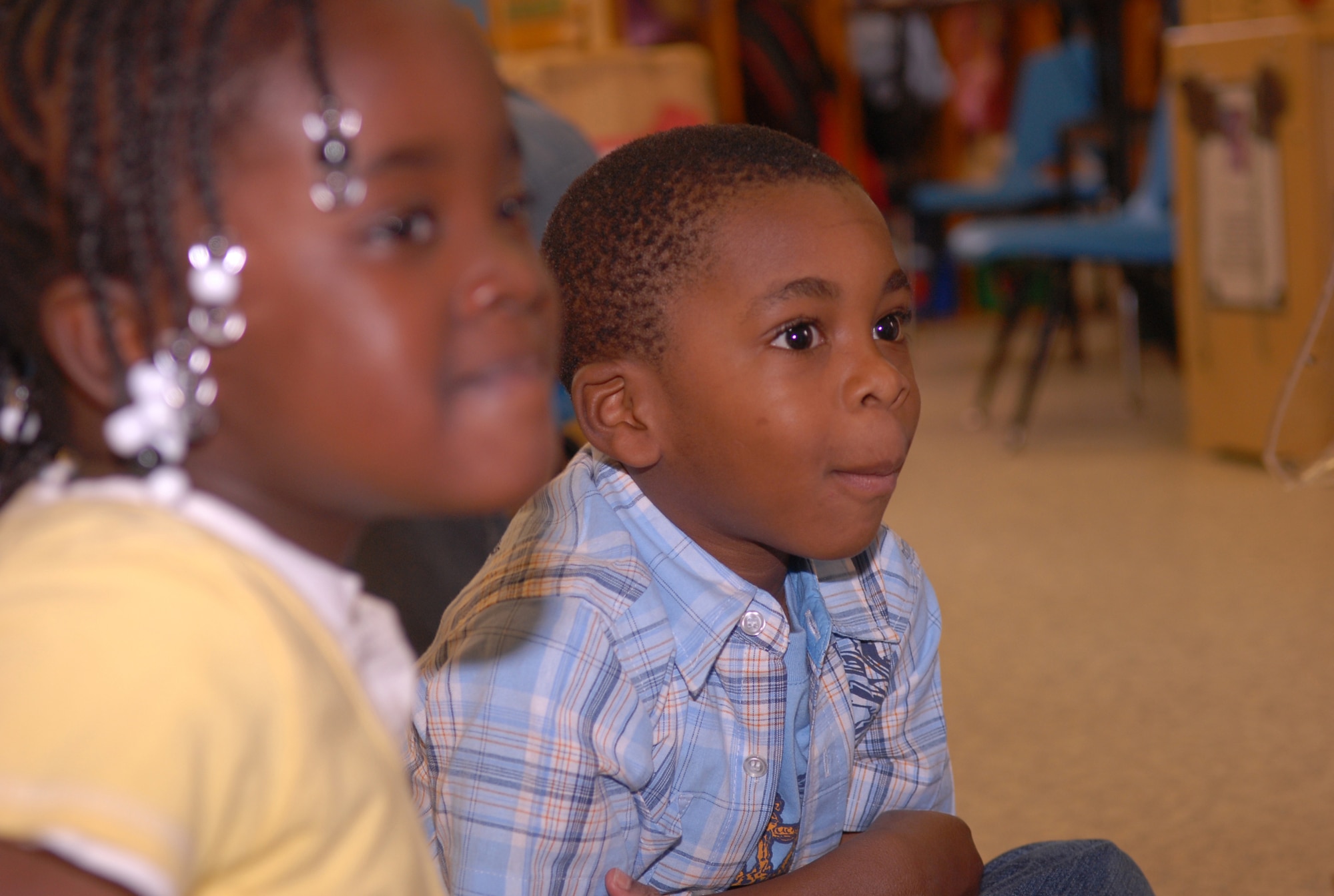 Students in the Head Start program in Fayetteville listen as Lt. Col. Terri Bailey, 43rd Medical Squadron, Commander reads children's books March 11. (U.S. Air Force Photo/ 2nd Lt. Cammie Quinn)