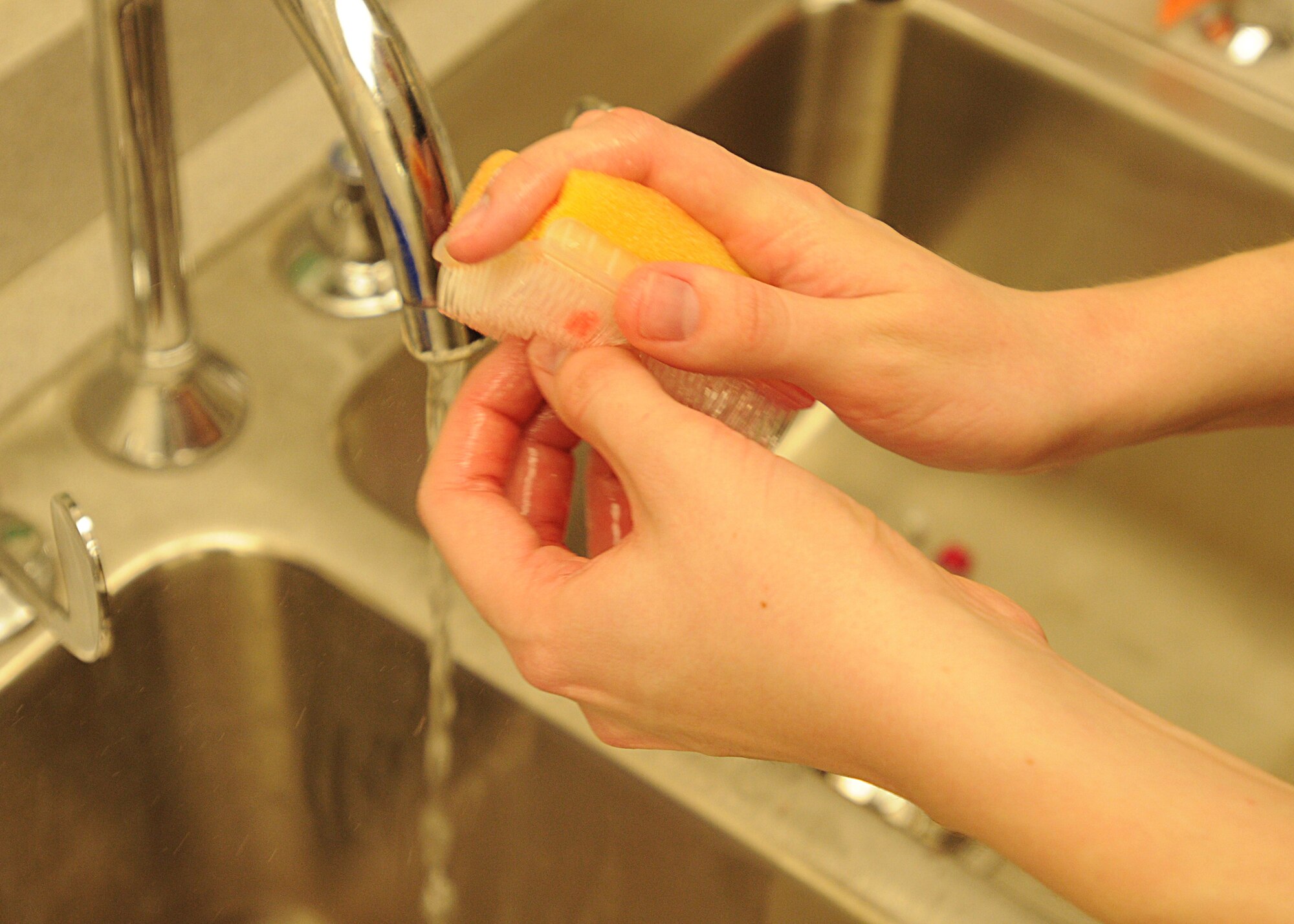 Senior Airman Melissa Guzman, 31st Medical Support Squadron, cleans her hands with antimicrobial skin cleanser before preparing an intravenous medication at the Aviano pharmacy Mar. 11, 2010.  This solution is used to kill bacteria that are resistant to some antibiotics.  (U.S. Air Force photo/Senior Airman Tabitha M. Mans)