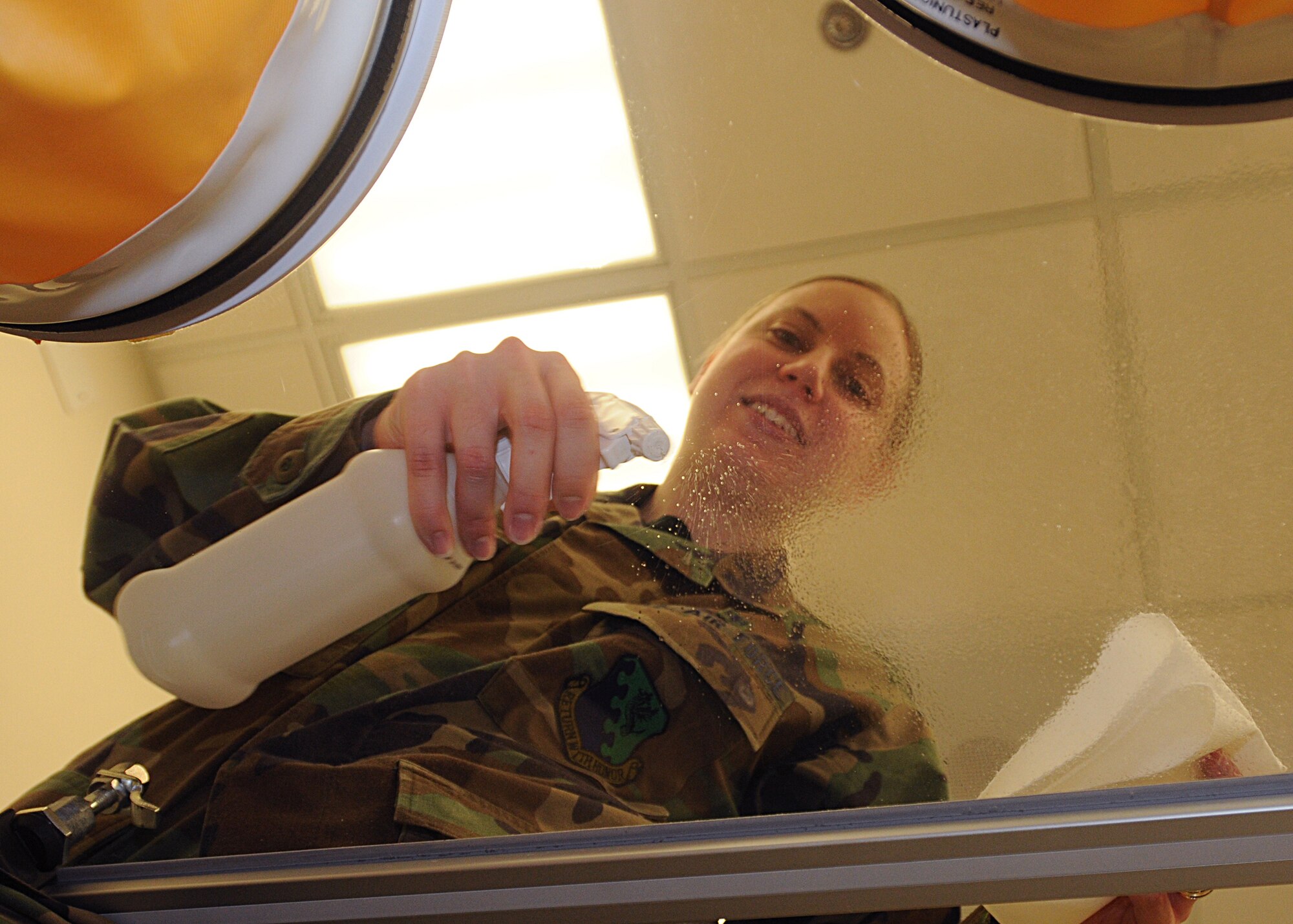 Senior Airman Melissa Guzman, 31st Medical Support Squadron, disinfects an intravenous hood with alcohol at the Aviano pharmacy March 11, 2010.  Keeping the I.V. hood sterile minimizes the possibility of contamination of I.V. products.  (U.S. Air Force photo/Senior Airman Tabitha M. Mans)