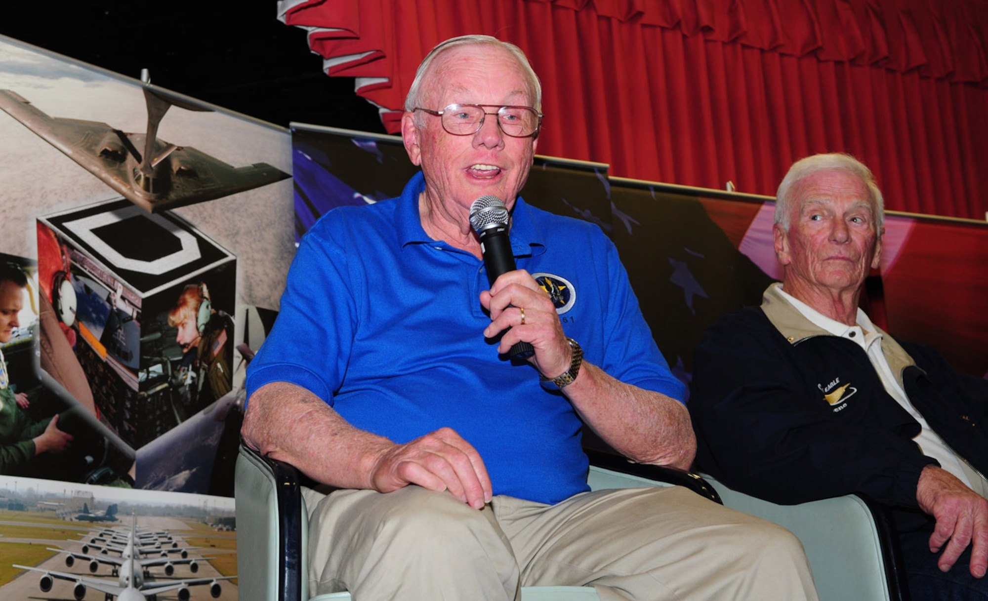 RAF MILDENHALL, England -- Neil Armstrong, left, the first man to set foot on the moon, shares his stories and experiences with members of Team Mildenhall in the Galaxy Club March 11. (U.S. Air Force photo by Karen Abeyasekere)
