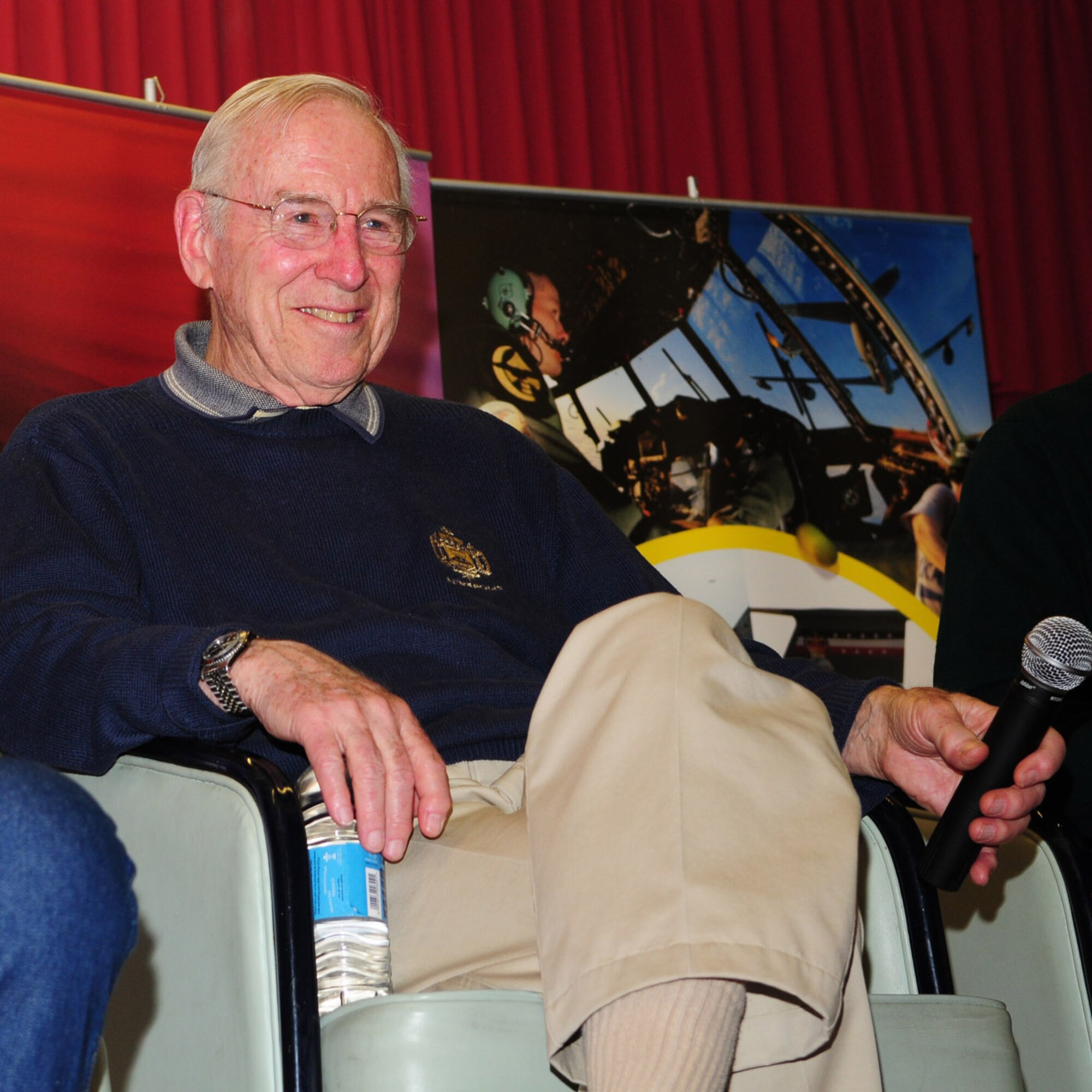 RAF MILDENHALL, England -- Jim Lovell, Apollo 13 commander and one of only three men to travel to the moon twice, laughs at comments made by his fellow “Legends of Aerospace” before sharing his stories with about 1,000 military and civilian Team Mildenhall members and their families at the Galaxy Club March 11. (U.S. Air Force photo by Karen Abeyasekere)