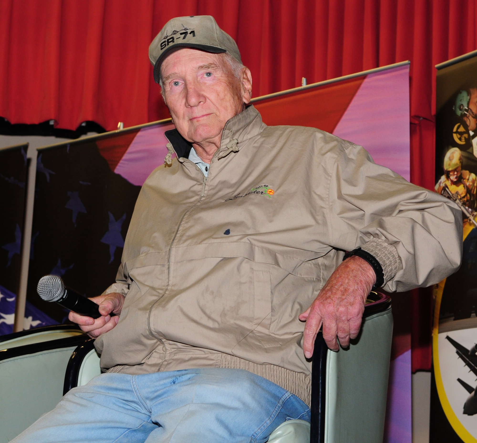 RAF MILDENHALL, England -- Bob Gilliland, former chief test pilot and first to fly the SR-71 Blackbird, prepares to talk to members of Team Mildenhall at the “Legends of Aerospace: The Impossible is Possible” tour at the Galaxy Club March 11. Approximately 1,000 people who came to watch the legends share their stories. (U.S. Air Force photo by Karen Abeyasekere)