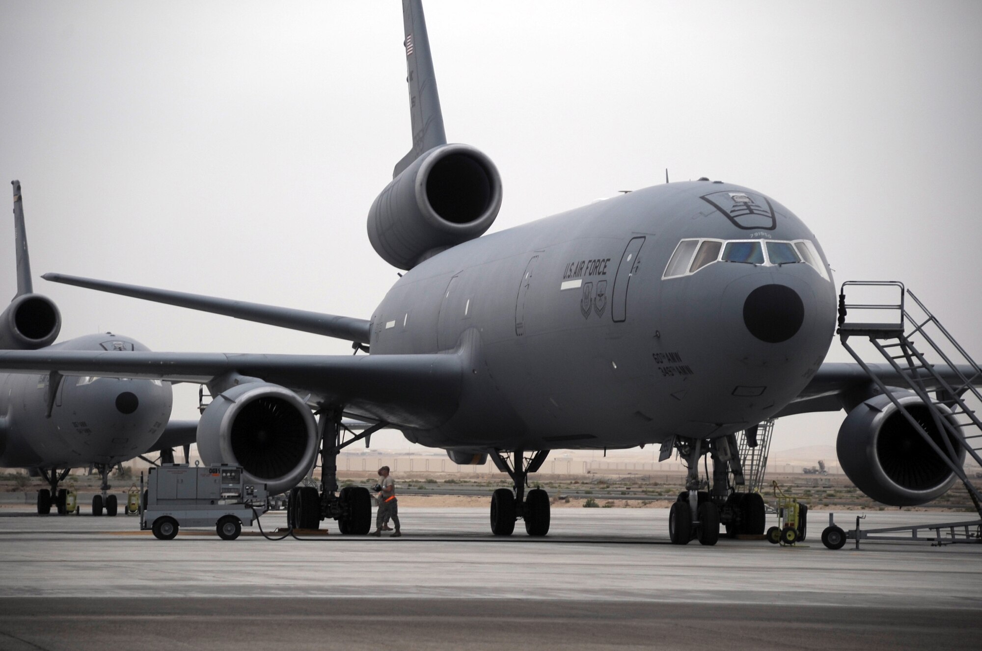 Airmen from the 380th Expeditionary Aircraft Maintenance Squadron work on a KC-10 Extender that is parked on the flightline of the 380th Air Expeditionary Wing at a non-disclosed base in Southwest Asia on March 2, 2010.  The KC-10 is assigned to the 908th Expeditionary Air Refueling Squadron. The 908th EARS, as part of the 380th AEW, supports operations Iraqi Freedom and Enduring Freedom and the Combined Joint Task Force-Horn of Africa. (U.S. Air Force Photo/Master Sgt. Scott T. Sturkol/Released)