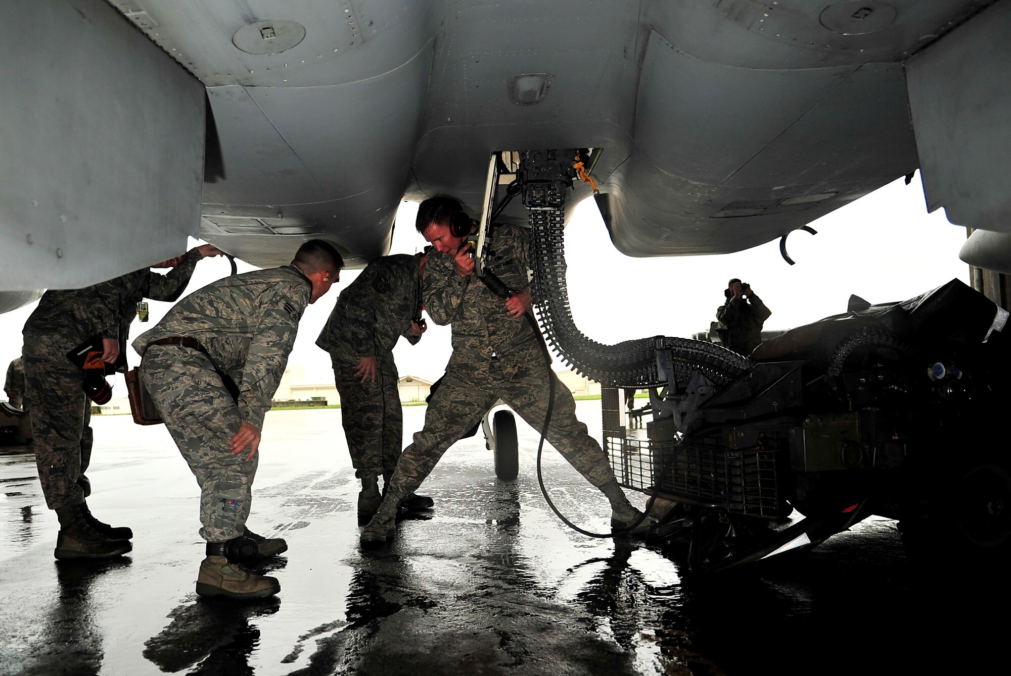 Staff Sgt. Michael Clark, 18th Aircraft Maintenance Squadron weapons crew chief, attaches an ammunition loading system onto an F-15 Eagle during the Turkey Shoot 2010 at Kadena Air Base, Japan, March 9. The Turkey Shoot is an annual internal competition intended to sharpen operational capabilities and assign bragging rights. (U.S. Air Force photo/Tech. Sgt. Rey Ramon)                      