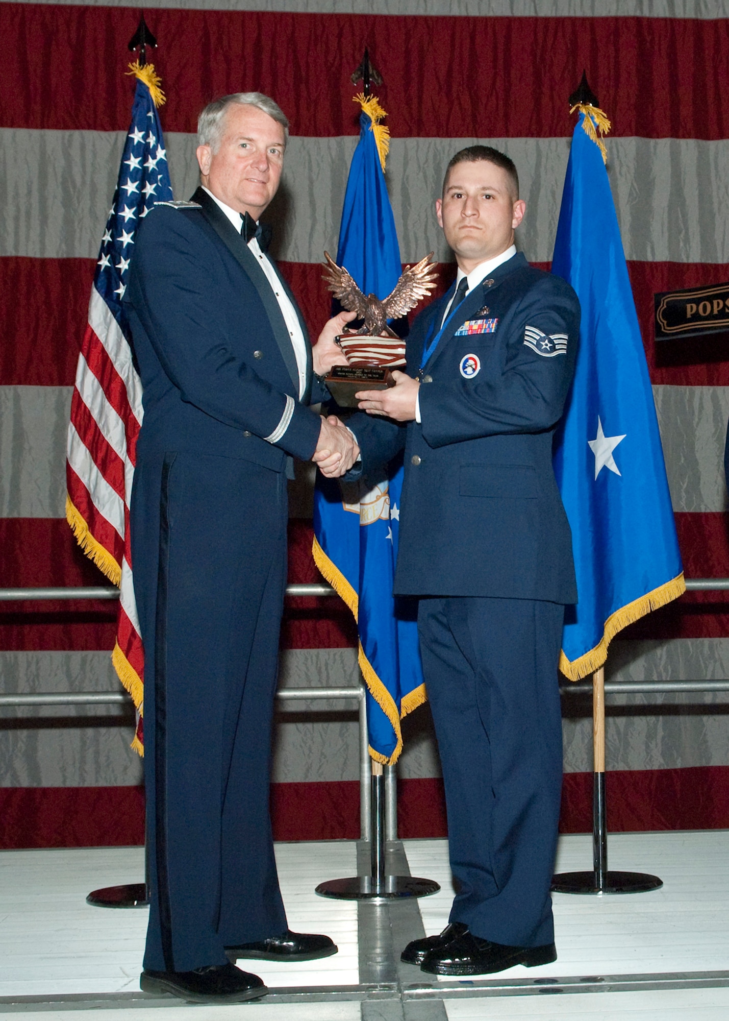 Staff Sgt. Charles N. Sibus, ceremonial guardsman, receives the Honor Guard of the Year Award during the Air Force Flight Test Center Annual Awards ceremony March 12. (Air Force photo/Mike Yncera)