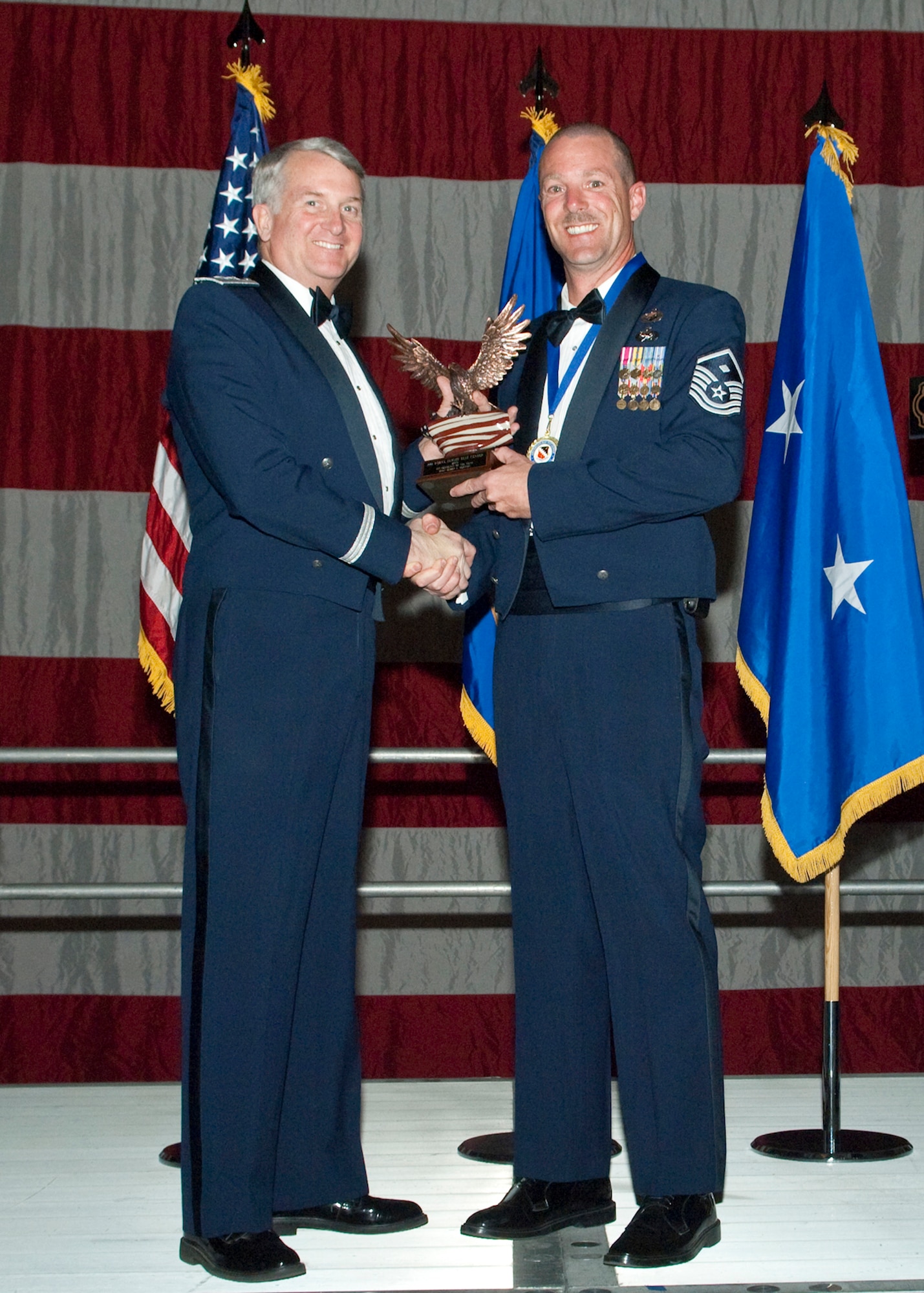 Master Sgt. Bobby Herron 31st Test and Evaluation Squadron first sergeant, receives the First Sergeant of the Year Award during the Air Force Flight Test Center Annual Awards ceremony March 12. (Air Force photo/Mike Yncera)