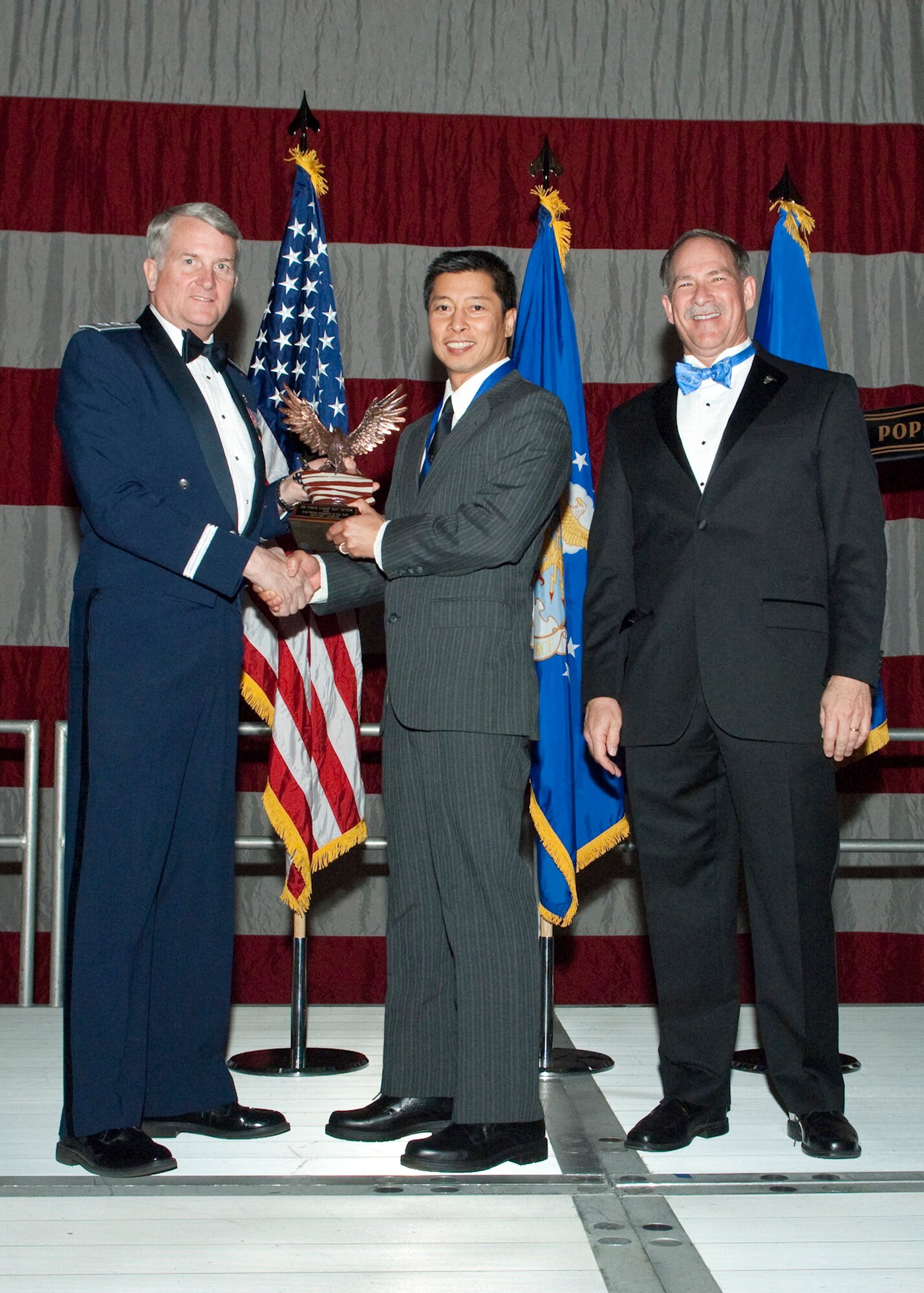 Louis Vasquez, 412th Maintenance Squadron training leader Munitions Inspection, receives the Scientific and Engineering Civilian of the Year Award during the Air Force Flight Test Center Annual Awards ceremony March 12. (Air Force photo/Mike Yncera)