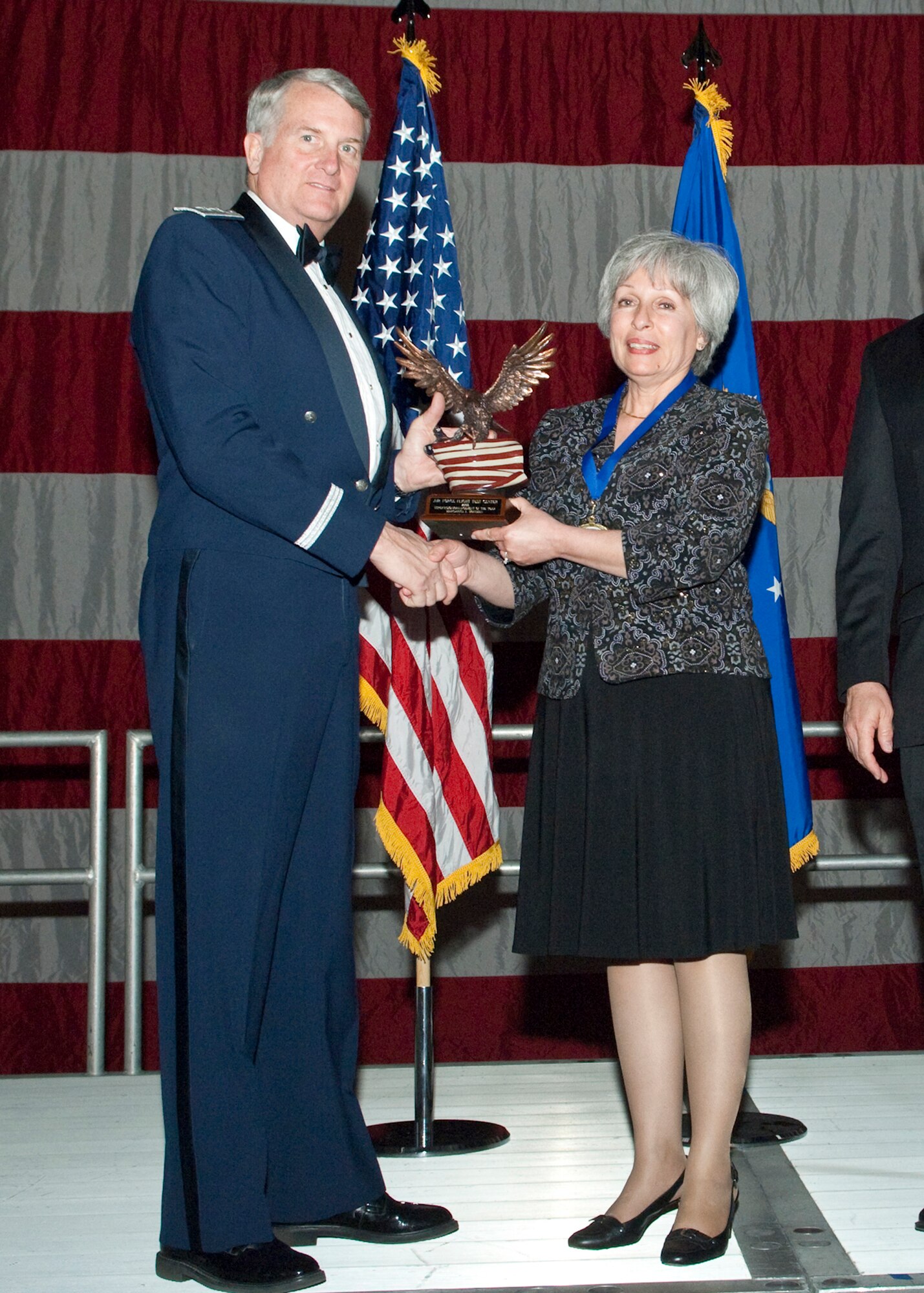 Margarita L. Hoffman, 95th Comptroller Squadron Financial Management chief Financial Analysis Operation, receives the Supervision and Management Civilian of the Year Award during the Air Force Flight Test Center Annual Awards ceremony March 12. (Air Force photo/Mike Yncera)