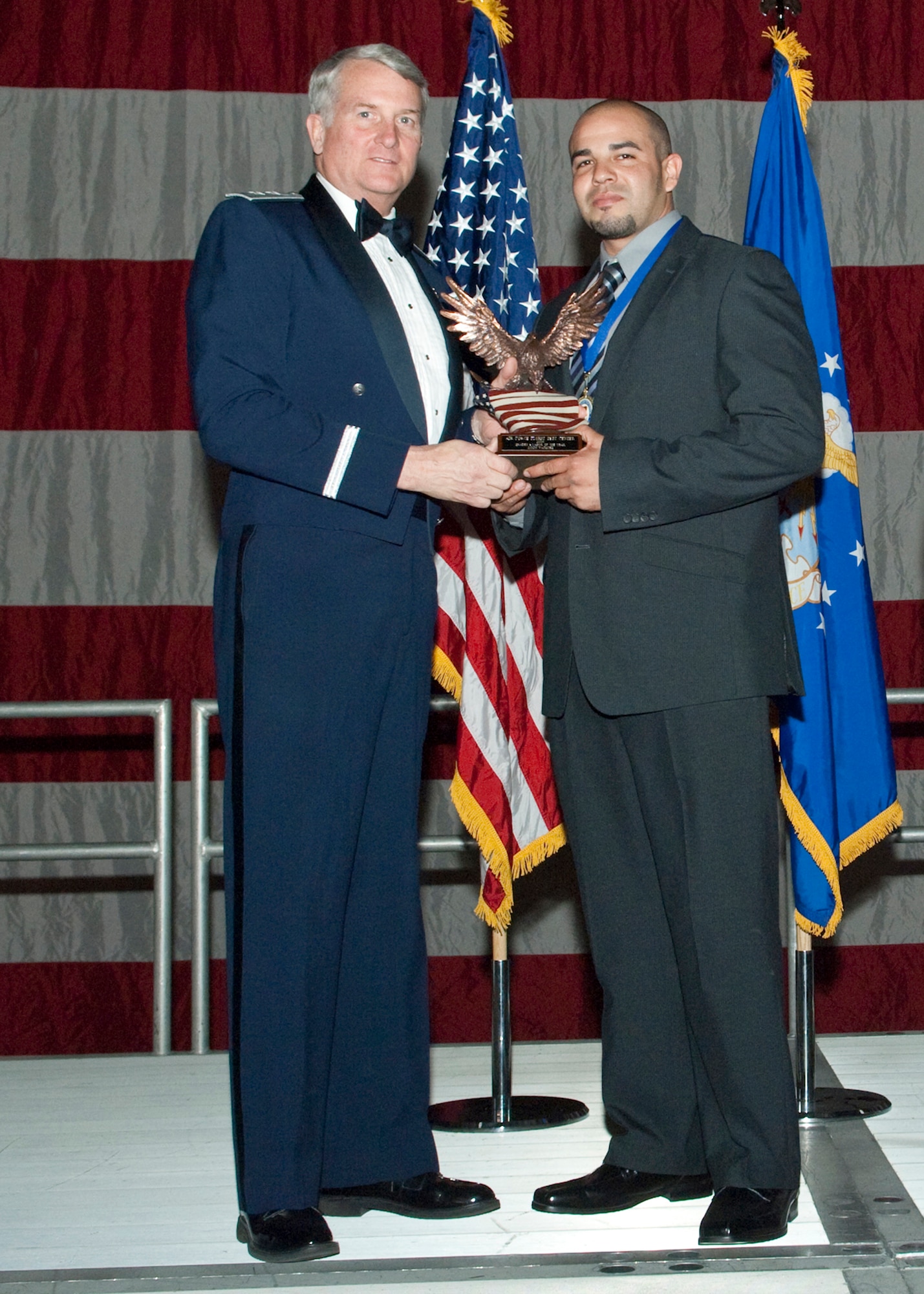 Reynaldo F. Enriquez, Air Force Flight Test Center Test System Safety engineer, receives the Trades and Labor Civilian of the Year Award during the Air Force Flight Test Center Annual Awards ceremony March 12. (Air Force photo/Mike Yncera)
