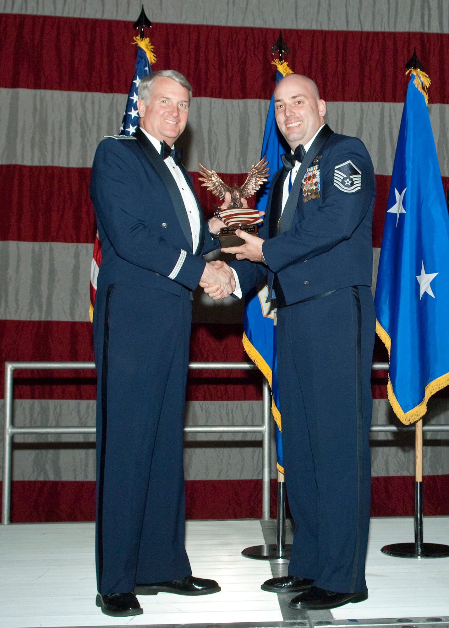 Master Sgt. Daniel Halverstadt, 412th Operations Group standards and evaluations superintendent, receives the Senior Noncommissioned Officer of the Year during the Air Force Flight Test Center Annual Awards ceremony March 12. (Air Force photo/Mike Yncera)