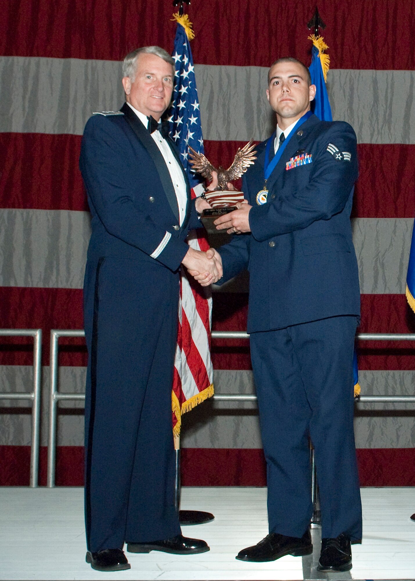 Senior Airman Matthew J. Mosko, 412th Aircraft Maintenance Squadron Egress Systems specialist, receives the Airman of the Year during the Air Force Flight Test Center Annual Awards ceremony March 12. (Air Force photo/Mike Yncera)