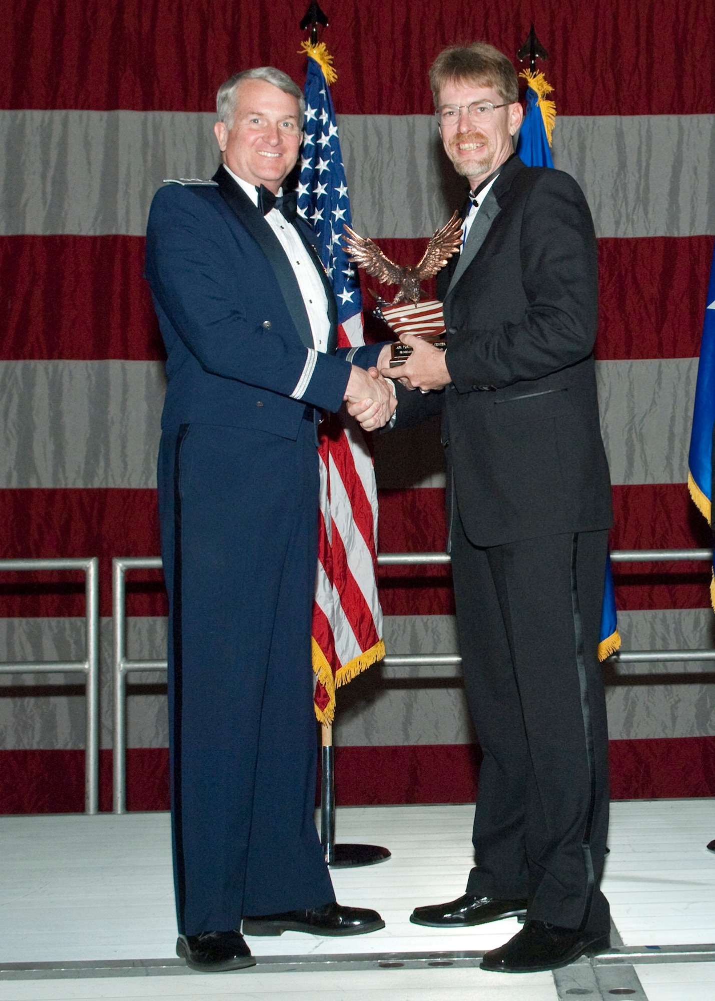Todd D. Amon, 95th Aerospace Medicine Squadron Health and Wellness Center information manager, receives the Secretarial and Clerical Civilian of the Year during the Air Force Flight Test Center Annual Awards ceremony March 12. (Air Force photo/Mike Yncera)