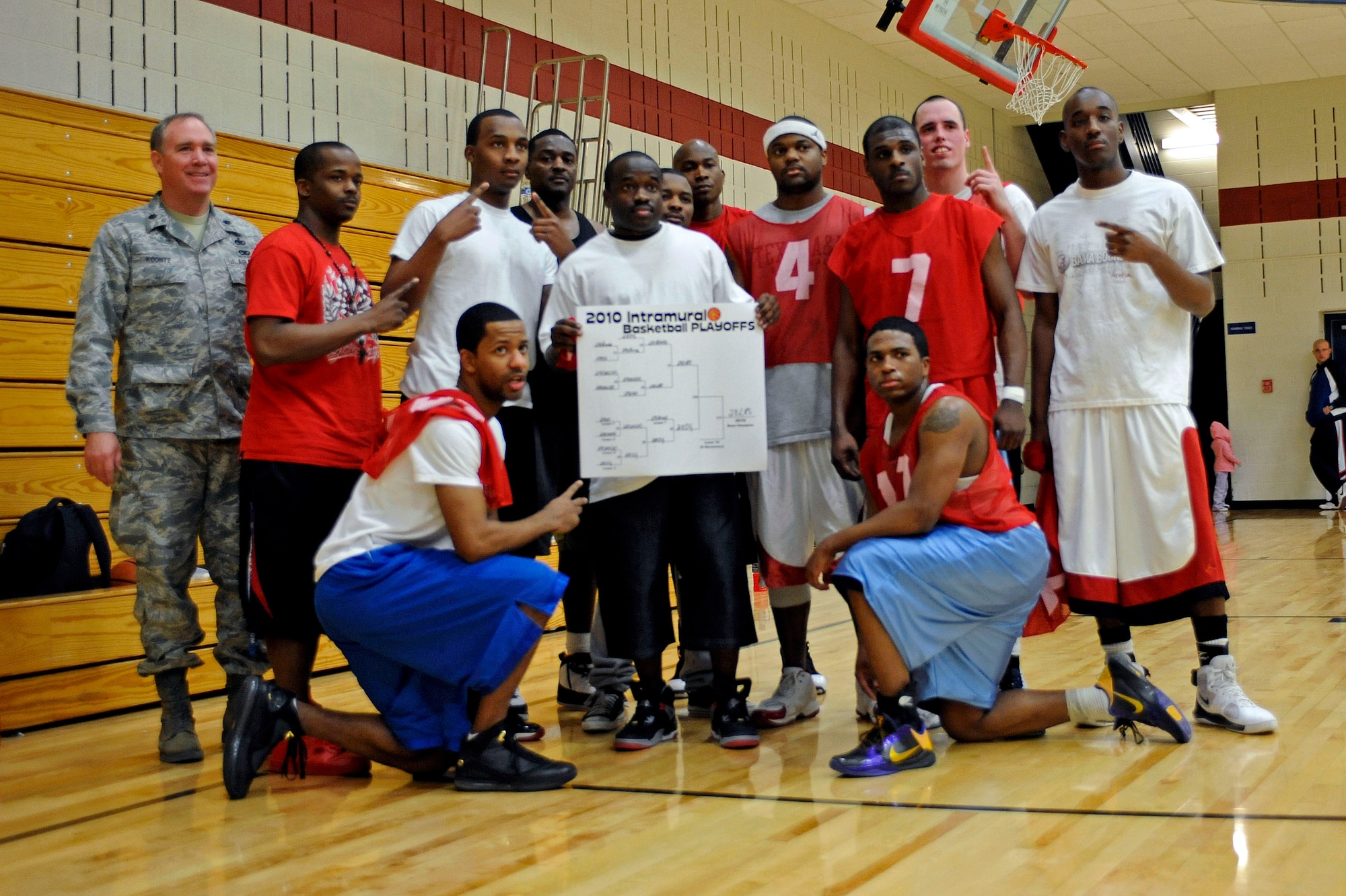 ELLSWORTH AIR FORCE BASE, S.D. -- Members of the 28th Logistics Readiness Squadron pose for a group photo after winning Ellsworth's intramural basketball championship game, March 16. The 28 LRS team defeated the 28th Operations Group, 61-58. (U.S. Air Force photo/Airman 1st Class Matthew Flynn)