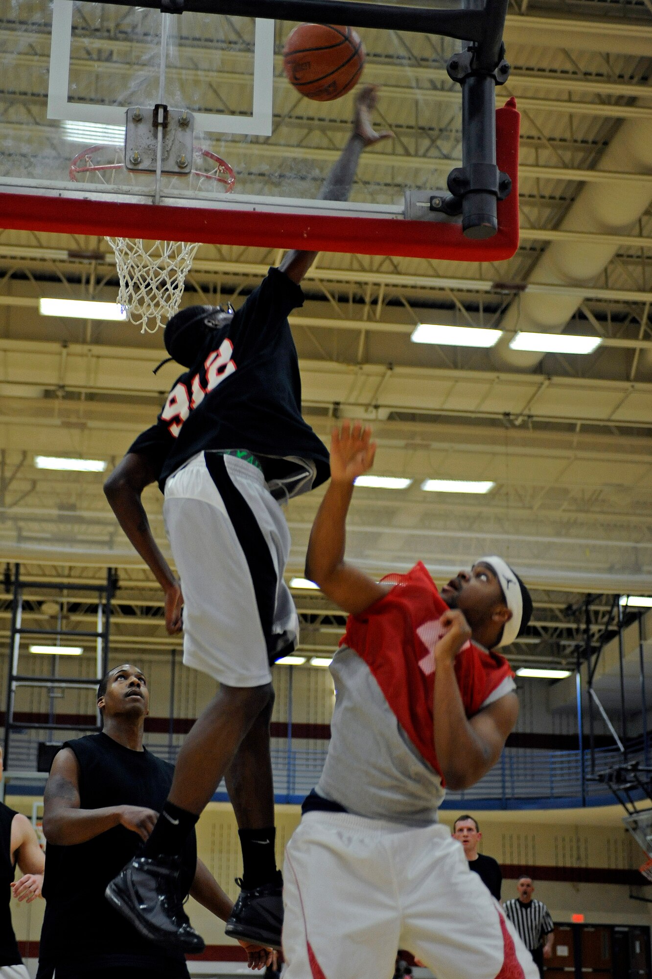 ELLSWORTH AIR FORCE BASE, S.D. -- (Left) Senior Airman Adam Grant, 28th Bomb Wing still photographic journeyman, attempts to block a shot during the Ellsworth's intramural basketball championship game, March 16. The 28th Logistics Readiness Squadron won the game in regulation, 61-58. (U.S. Air Force photo/Airman 1st Class Matthew Flynn)