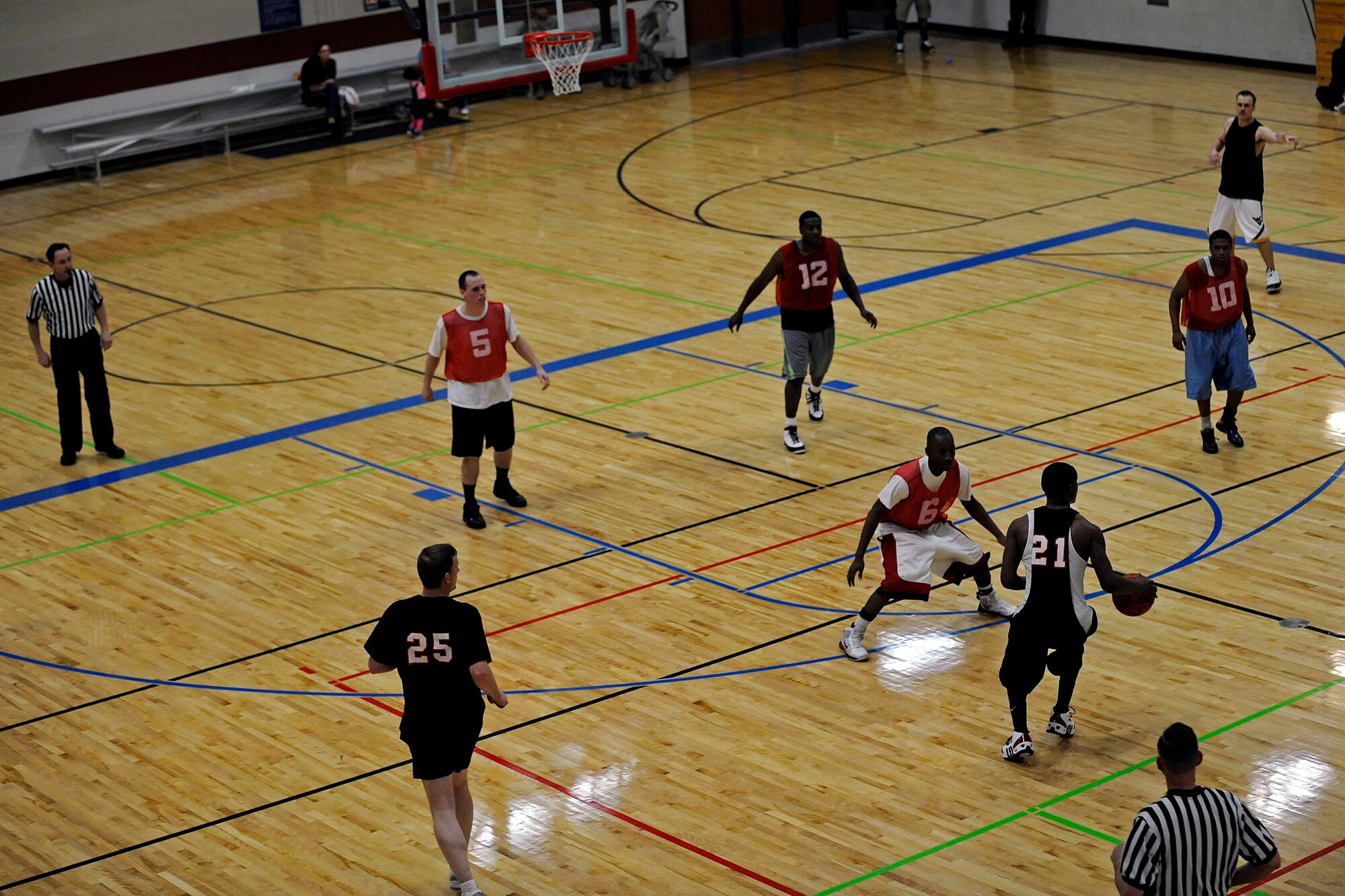 ELLSWORTH AIR FORCE BASE, S.D. -- Members of the 28th Operations Group and 28th Logistics Readiness Squadron settle into their half-court sets during Ellsworth's intramural basketball championship game, March 16. The game featured more than 100 combined points and 17 fouls. (U.S. Air Force photo/Airman 1st Class Matthew Flynn)