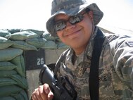 Tech. Sgt. Marcos of the 940th Services Flight smiles for the camera during his deployment to Afghanistan.