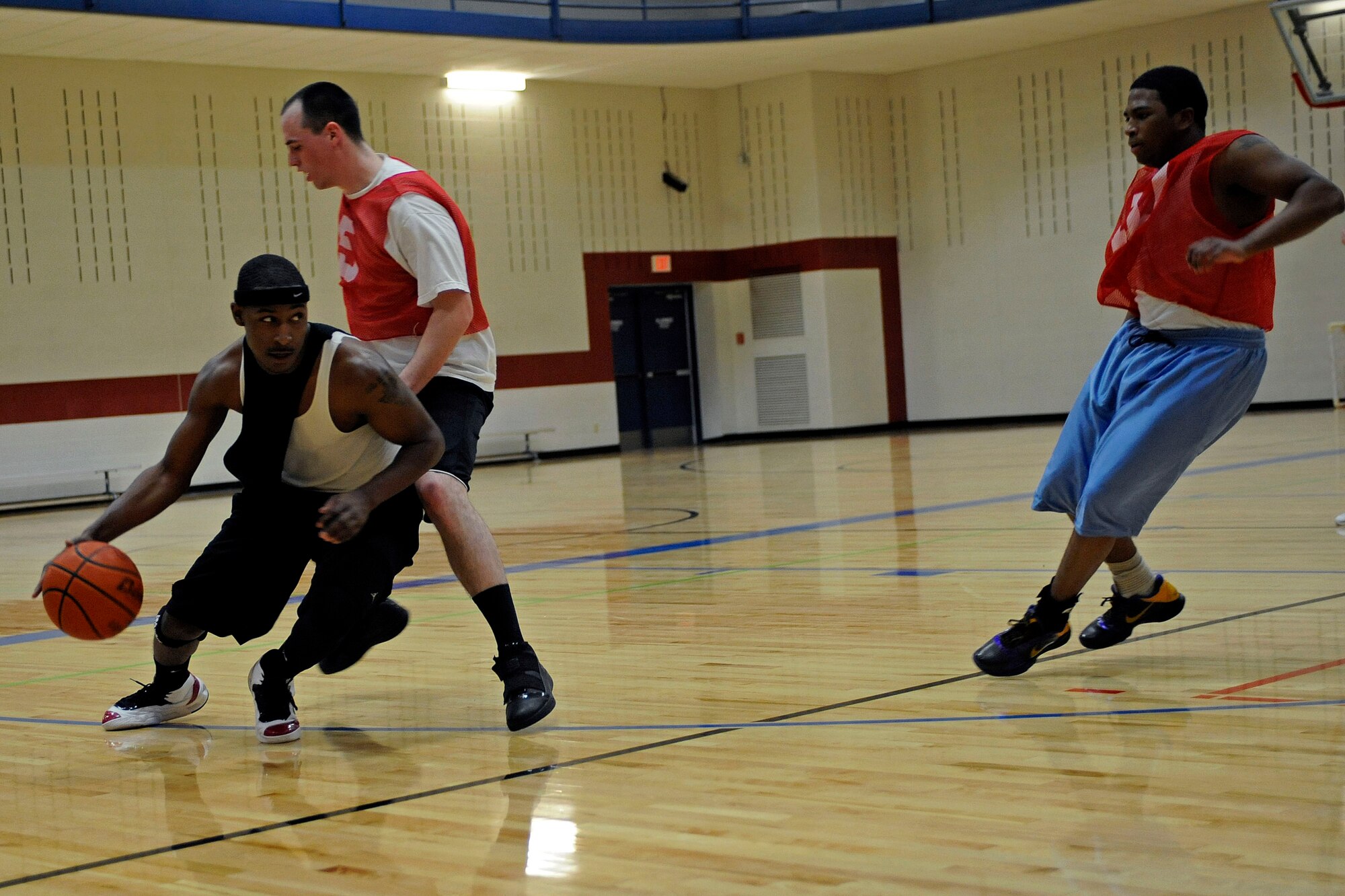 ELLSWORTH AIR FORCE BASE, S.D. -- (Left) Airman 1st Class Dan Goodson, 28th Operations Support Squadron communications security technician, attempts to break full-court pressure from Airman 1st Class Greg Presley, 28th Logistics Readiness Squadron, during Ellsworth's intramural basketball championship game, March 16. The 28 LRS won the game with a final score of 61-58. (U.S. Air Force photo/Airman 1st Class Matthew Flynn)