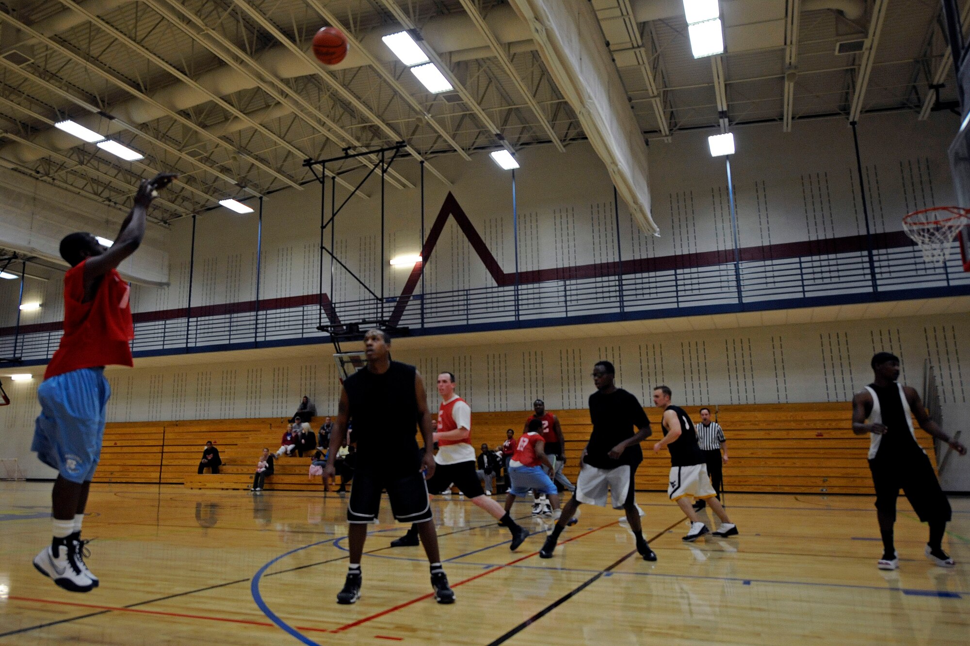 ELLSWORTH AIR FORCE BASE, S.D. -- Senior Airman Brandon Bussey, 28th Logistics Readiness Squadron traffic management office journeyman, attempts a 3-point shot during Ellsworth's intramural basketball championship game. The 28 LRS team beat the 28th Operations Group team, 61-58, to win the championship. (U.S. Air Force photo/Airman 1st Class Matthew Flynn)