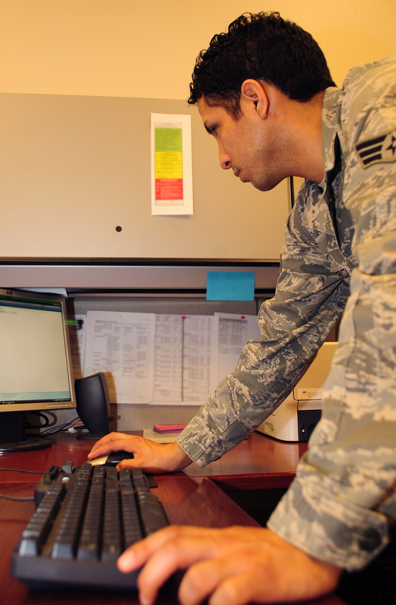 ELLSWORTH AIR FORCE BASE, S.D. -- Senior Airman Joshua Ortiz-Mendoza, 28th Mission Support Group client systems technician, troubleshoots a printer at the 37th Bomb Squadron, March 16.  Airman Ortiz-Mendoza, as part of his duties as a CST, works on faulty computers as well as computer equipment across the base. U.S. Air Force photo/Airman 1st Class Anthony Sanchelli)

