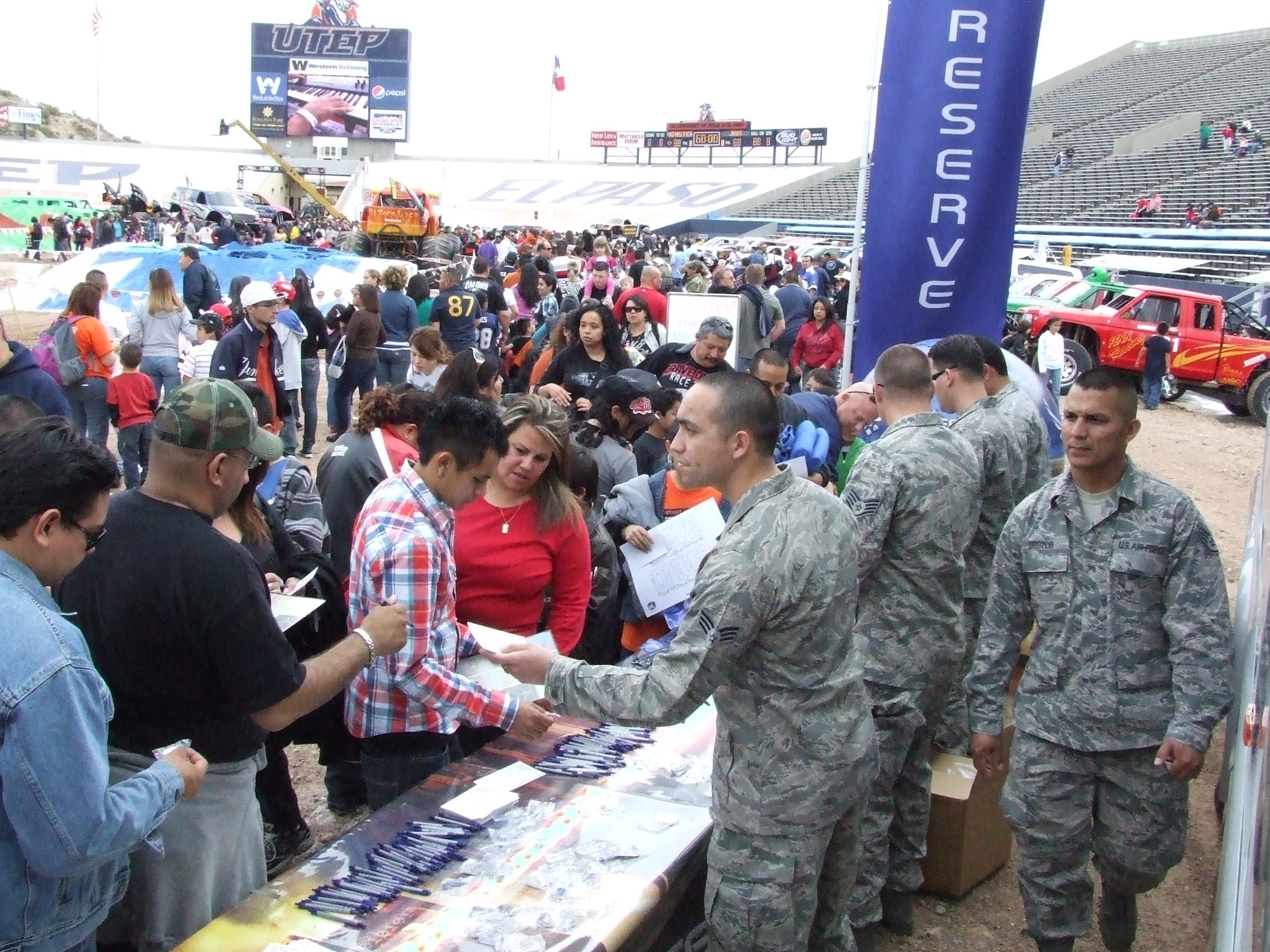 EL PASO, Texas -- Reservists from the 44th Fighter Group at Holloman Air Force Base, N.M., and recruiters from Texas, Georgia and Nevada, handed out nearly 20,000 pieces of Reserve recruiting material, March 6, 2010 during the Monster Jam Pit Party at the Sun Bowl Stadium. The pit party took place on the field a few hours before the sold-out main event. Recruiters received 70 leads on potential Reservists in three hours. (U.S. Air Force photo by Martha Whipple)