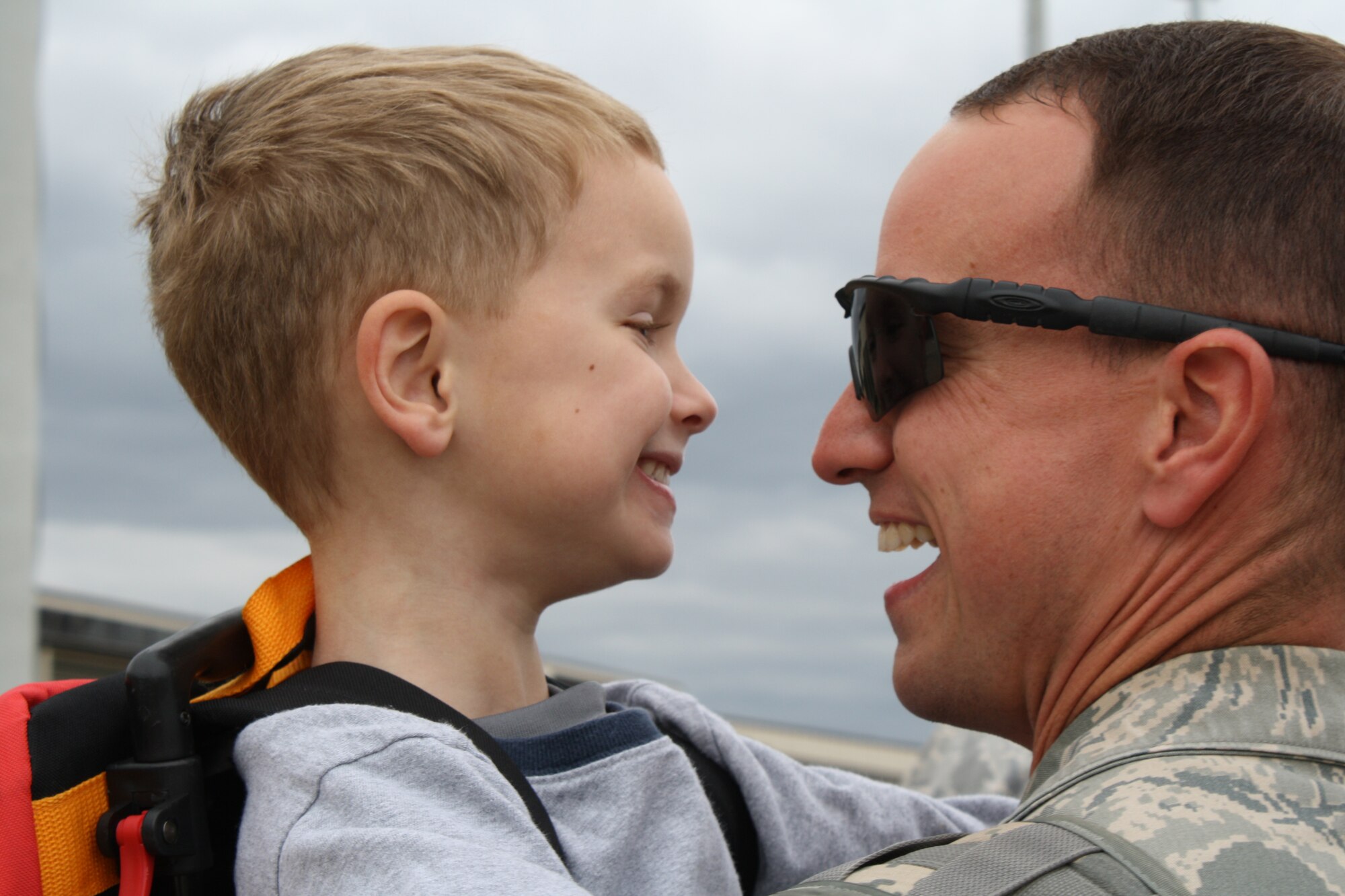 Master Sgt. Steven Thomas, 3rd Aerial Port Squadron, greets his son, Avery at the passenger terminal March 16. Fifteen members from the 3rd APS returned to Pope from a six-month deployment to Camp Bastion, Afghanistan March 16. (U.S. Air Force Photo by 2nd Lt. Cammie Quinn)
