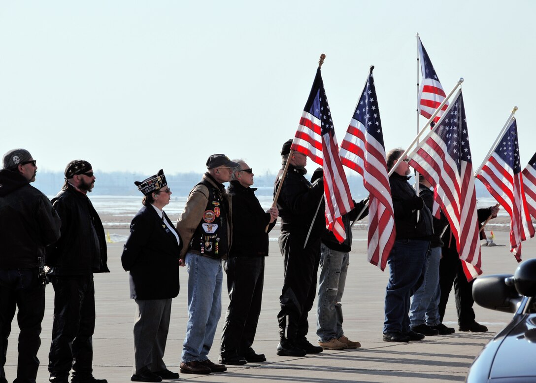Patriot Guard Riders pay tribute to a fallen American Soldier, March 11, 2010, Niagara Falls, NY. When invited by the family of the deceased, Patriot Guard Riders show their support by attending the ceremonies of fallen patriots. (U.S. Air Force photo by Staff Sgt. Joseph McKee)