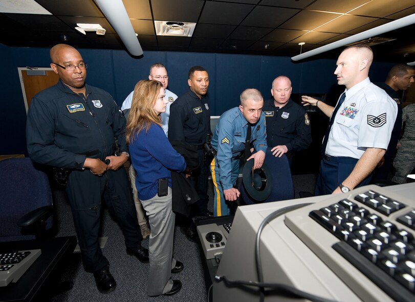 Members of the Delaware State Police Department aviation section receive a facility tour from members of Team Dover's air traffic control units. This tour was to increase the synergy between the two offices, as well as make possible changes to procedures on both sides in the interests of safety and efficiency. (U.S. Air Force photo/Jason Minto)