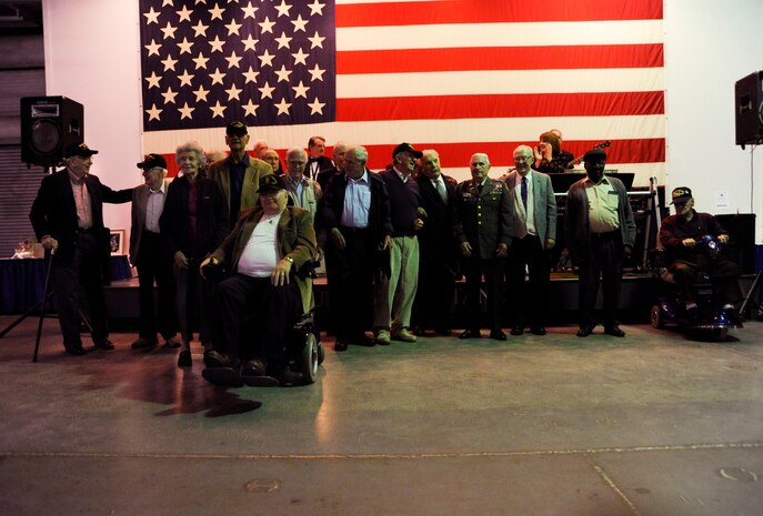 World War II veterans receive an applause at the World War II Hanger Dance on the USS Yorktown in Mount Pleasant, S.C., March 13, 2010. All proceeds from the event go toward the Honor Flight program. The flights leave from various cities around the United States and take World War II veterans to Washington D.C. for a day of sightseeing, remembering and honoring among its numerous memorials. (U.S. Air Force photo by Airman 1st Class Alexandra Hoachlander)(Released)