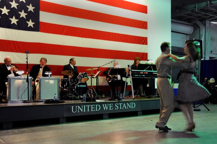 Attendees of the World War II Hanger Dance on the USS Yorktown in Mount Pleasant, S.C., dance the night away in honor of World War II veterans March 13, 2010. The 1940s style Hangar Dance was held as a fundraiser which will donate 100 percent of the profits to the upcoming Honor Flight scheduled to leave Charleston this spring to make it possible for World War II veterans to go to Washington D.C. and see the numerous memorials. (U.S. Air Force photo by Airman 1st Class Alexandra Hoachlander)(Released)
