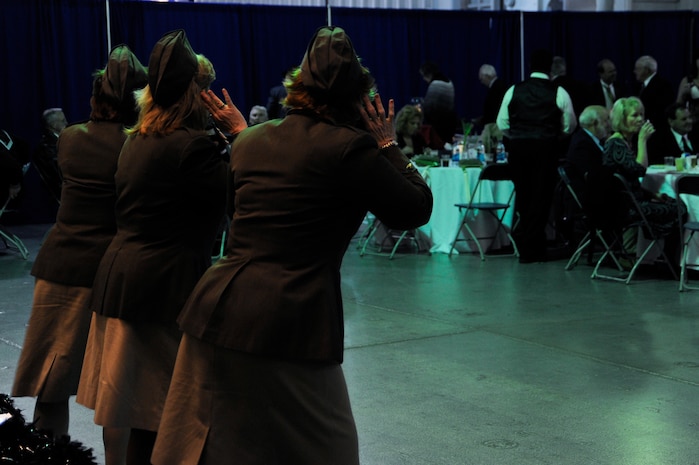 The group Vintage Vocals sings at the World War II Hanger Dance on the USS Yorktown in Mount Pleasant, S.C., in honor of World War II veterans March 13, 2010. All proceeds from the event go toward the Honor Flight program. The flights leave various cities around the United States and take World War II veterans to Washington D.C. for a day of sightseeing, remembering and honoring among its numerous memorials. (U.S. Air Force photo by Airman 1st Class Alexandra Hoachlander)(Released)