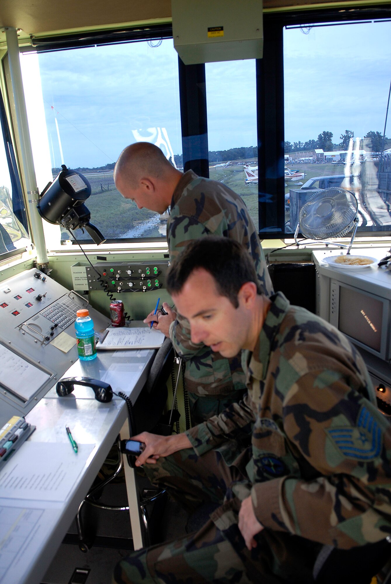 Technical Sergeants Isacc Steed, left and Scott Thompson, right, both Missouri Air National Guard members from the 241st Air Traffic Control Squadron in Saint Joseph, provide air traffic management at the  Tarkio Fly-in on July 12, 2008. (U.S. Air Force photo by Master Sgt. Greg Kunkle/Released)
