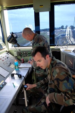 Technical Sergeants Isacc Steed, left and Scott Thompson, right, both Missouri Air National Guard members from the 241st Air Traffic Control Squadron in Saint Joseph, provide air traffic management at the  Tarkio Fly-in on July 12, 2008. (U.S. Air Force photo by Master Sgt. Greg Kunkle/Released)
