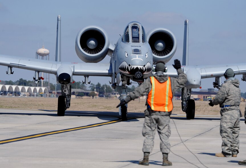 MOODY AIR FORCE BASE, Ga. -- Senior Airman Donald Ross, 23rd Aircraft Maintenance Squadron crew chief, gives directions to an A-10C Thunderbolt II aircraft pilot here March 3. The A-10 was lining up for a final inspection before takeoff during a scheduled flight. (U.S. Air Force photo by Airman 1st Class Joshua Green)