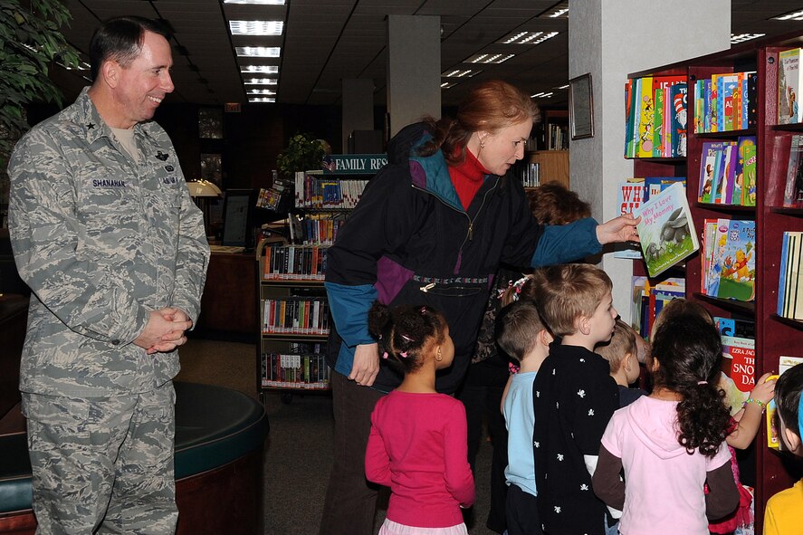 OFFUTT AIR FORCE BASE, Neb. - 55th Wing Commander Brig. Gen. John N.T. Shanahan and his wife, Laura, watch as children from one of Offutt's child development centers choose from more than 450 books donated by the Shanahans to the base library March 16. The books, in both hard and soft covers, include a wide selection of authors appropriate for children from birth to eighth grade.  U.S. Air Force photo by Kendra Williams