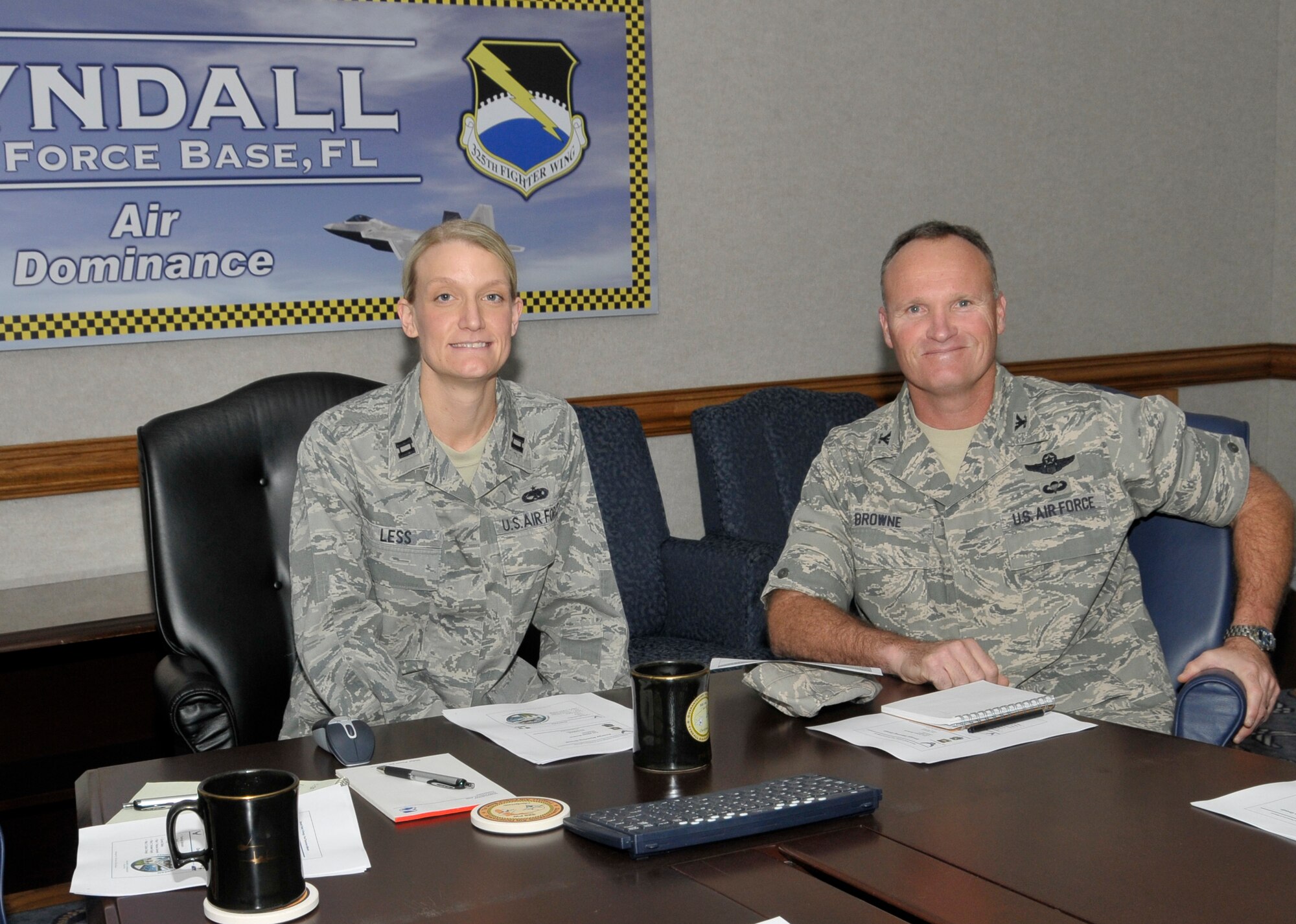 Capt. Seanna Less, 325th Maintenance Operations Squadron Operations Officer, shadows Col. James Browne, 325th Fighter Wing commander, during the Commander's Shadow Program Feb. 23. (U.S. Air Force photo/Lisa Norman)

