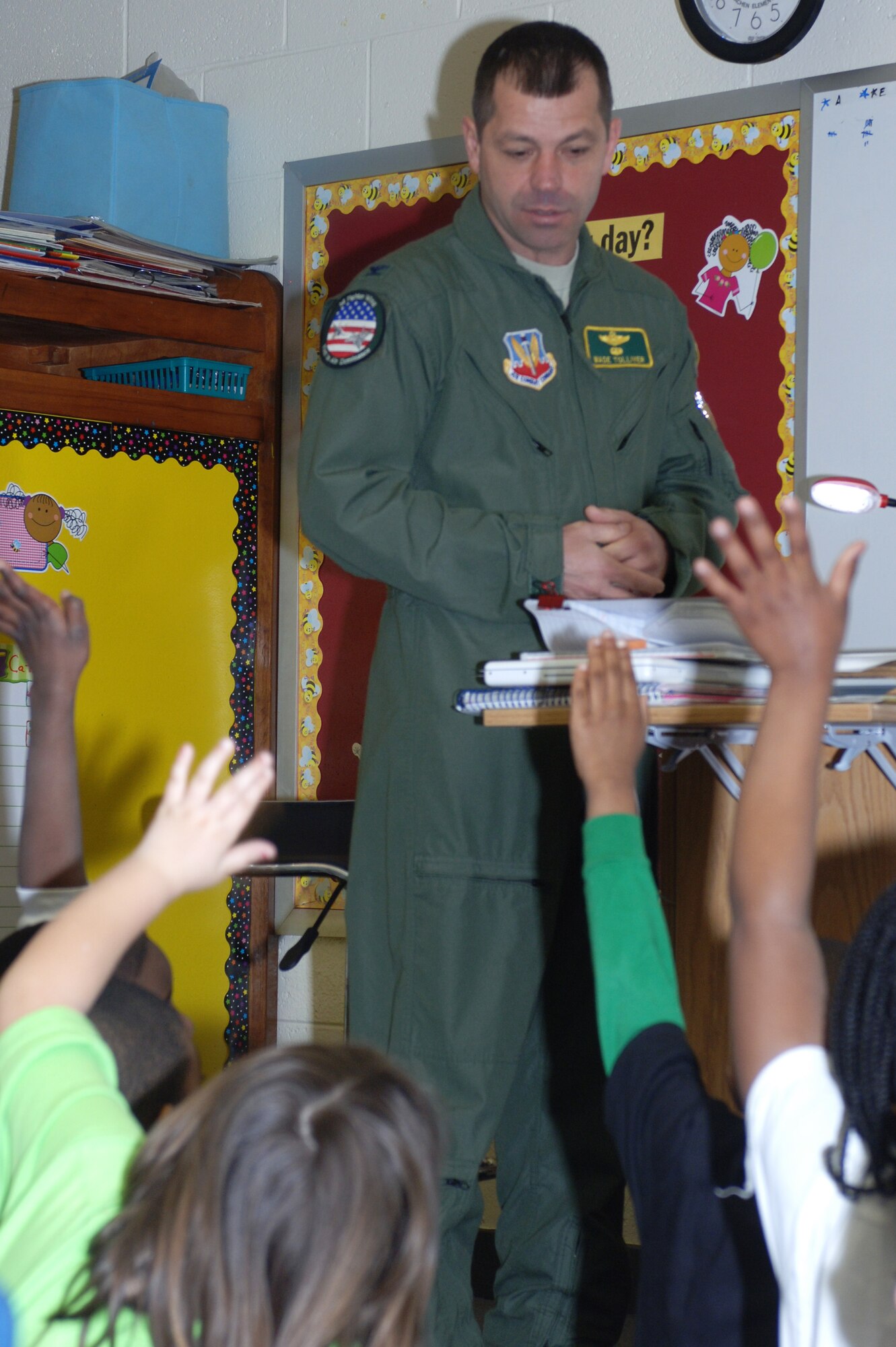 HAMPTON, Va. – Col. Wade Tolliver, 1st Fighter Wing vice commander, interacts with Mr. Semes and Mrs. Kozusko’s class at Machen Elementary School March 17 before continuing with "A Color of His Own" by Leo Lionni. Tolliver and several Langley Airmen often support the Mayor’s Book Club by reading to local area elementary school students. (U.S. Air Force photo/Staff Sgt. Heidi Davis)