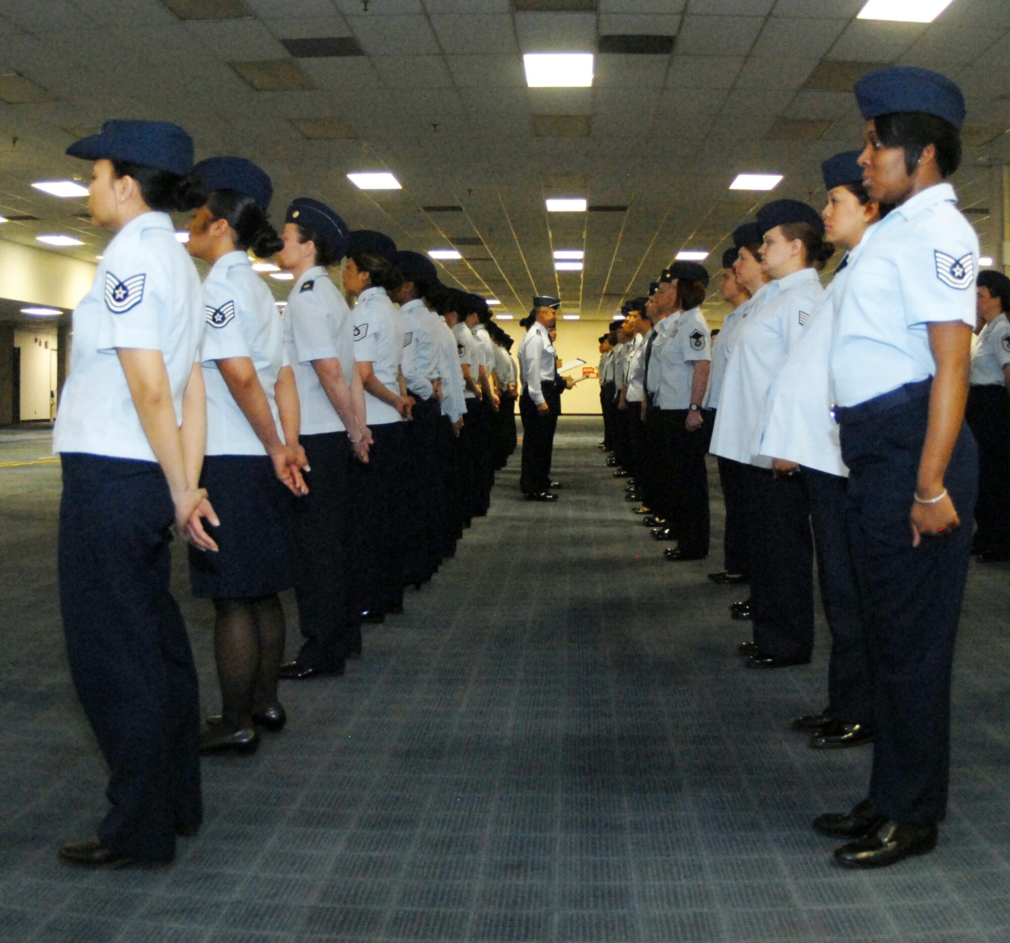 Airmen at the Air Reserve Personnel Center participate in an open-ranks inspection March 15. Brig. Gen. Kevin Pottinger, ARPC commander, said he held the inspection to remind Airmen of the importance of professionalism and proper dress and appearance. (U.S. Air Force photo/Dwayne Beuthel)