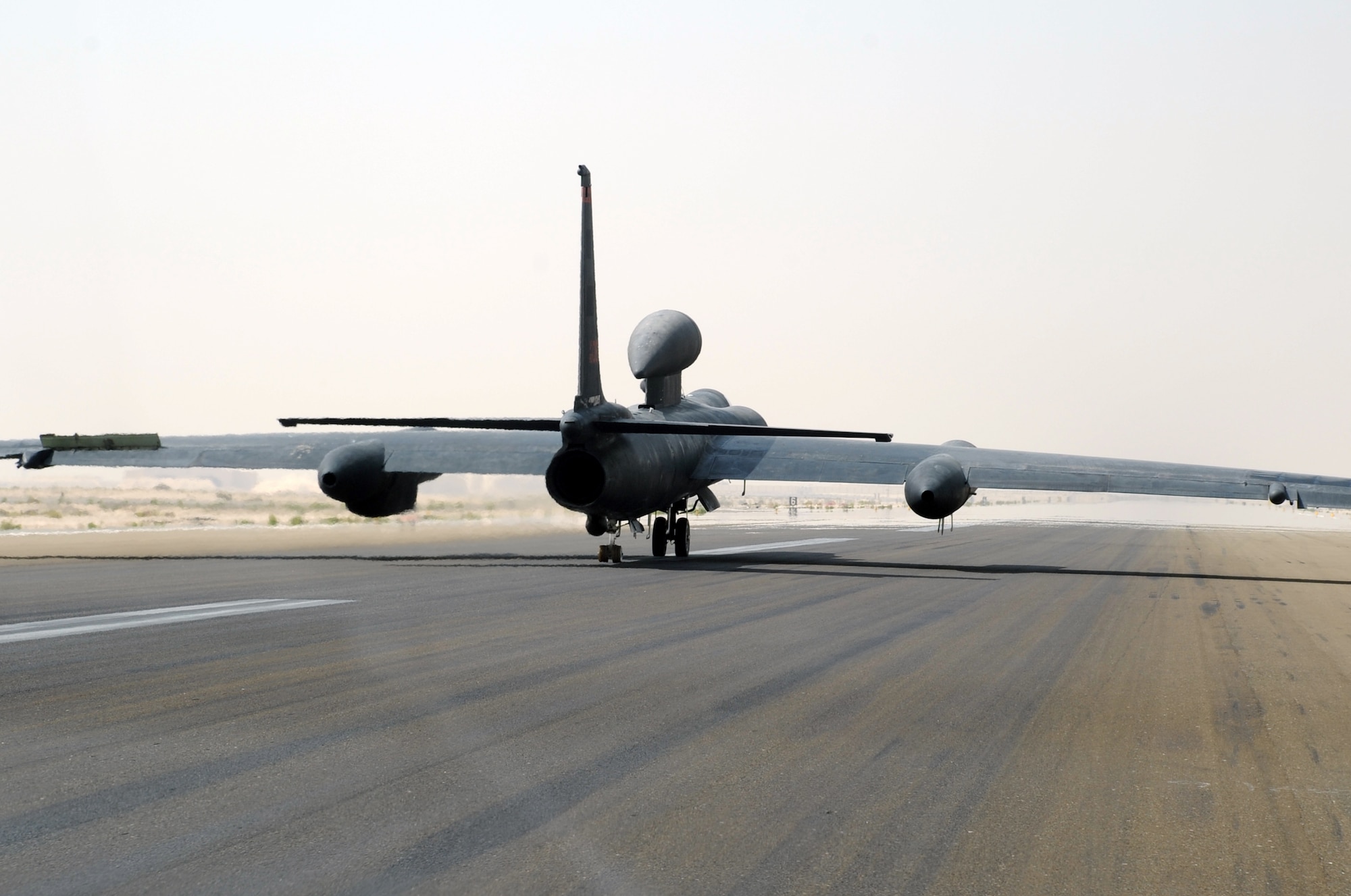 From the window of a U-2 chase car, Maj. William Gottenberg, U-2 pilot with the 99th Expeditionary Reconnaissance Squadron, is seen bringing a U-2 Dragon Lady in for a landing after completing his 100th combat mission in the U-2 from a non-disclosed base in Southwest Asia on March 9, 2010. The U-2 chase car helps the plane land safely. Major Gottenberg is deployed from Beale Air Force Base, Calif., and his hometown is Rocklin, Calif. (U.S. Air Force Photo/Master Sgt. Scott T. Sturkol/Released)