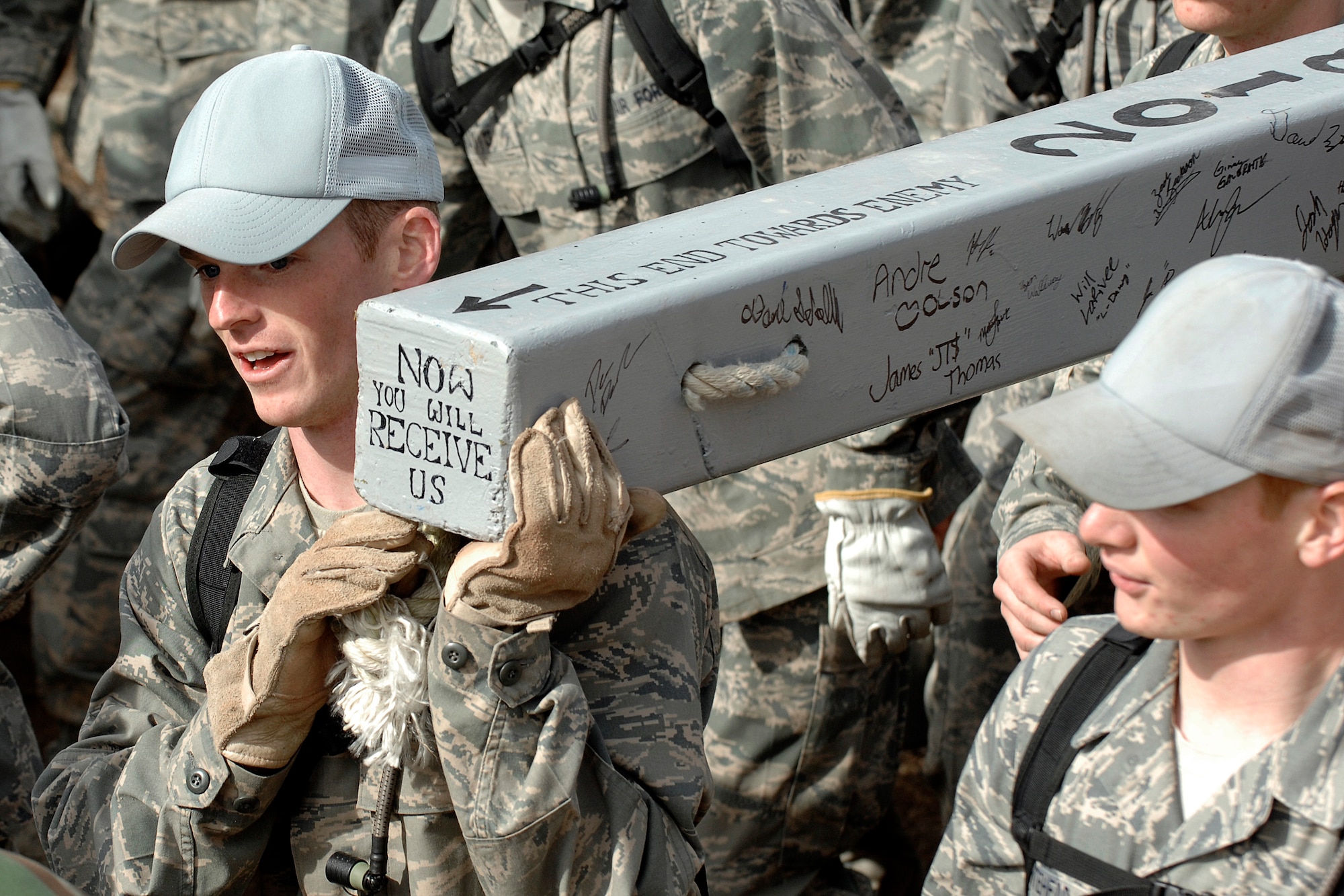 Cadet 4th Class Billy Tyrrel of Cadet Squadron 24 carries his squadron's charge on the return leg of The Run to the Rock during Recognition at the U.S. Air Force Academy March 13, 2010. At the end of the event, the freshmen are welcomed into the ranks of upper-class cadets. (U.S. Air Force Photo/Mike Kaplan)